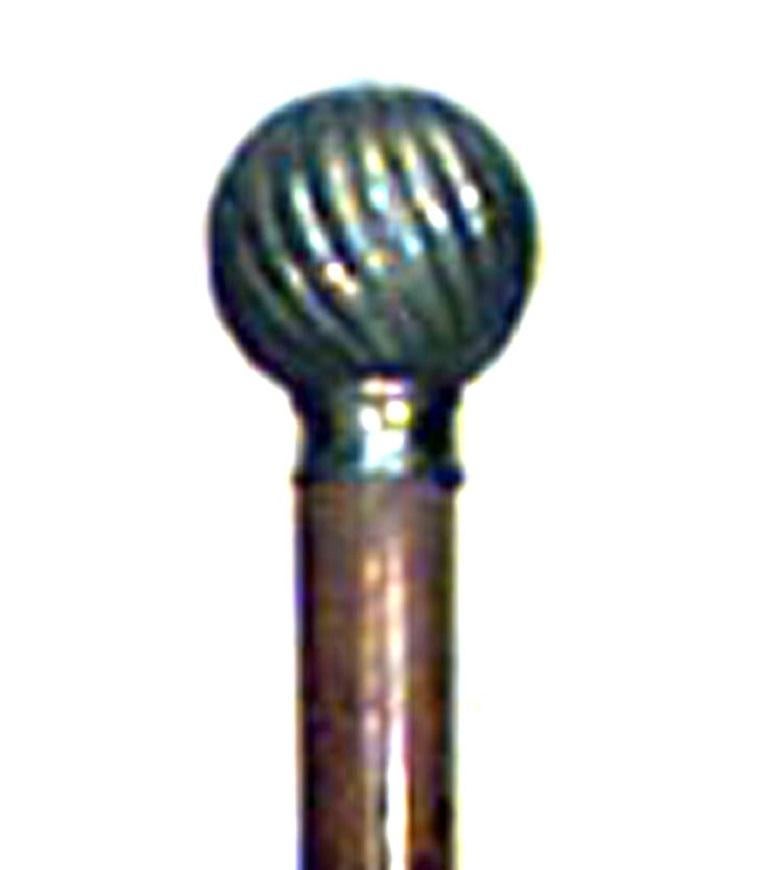 English Victorian wood cane with pewter swirl design ball top.
 
