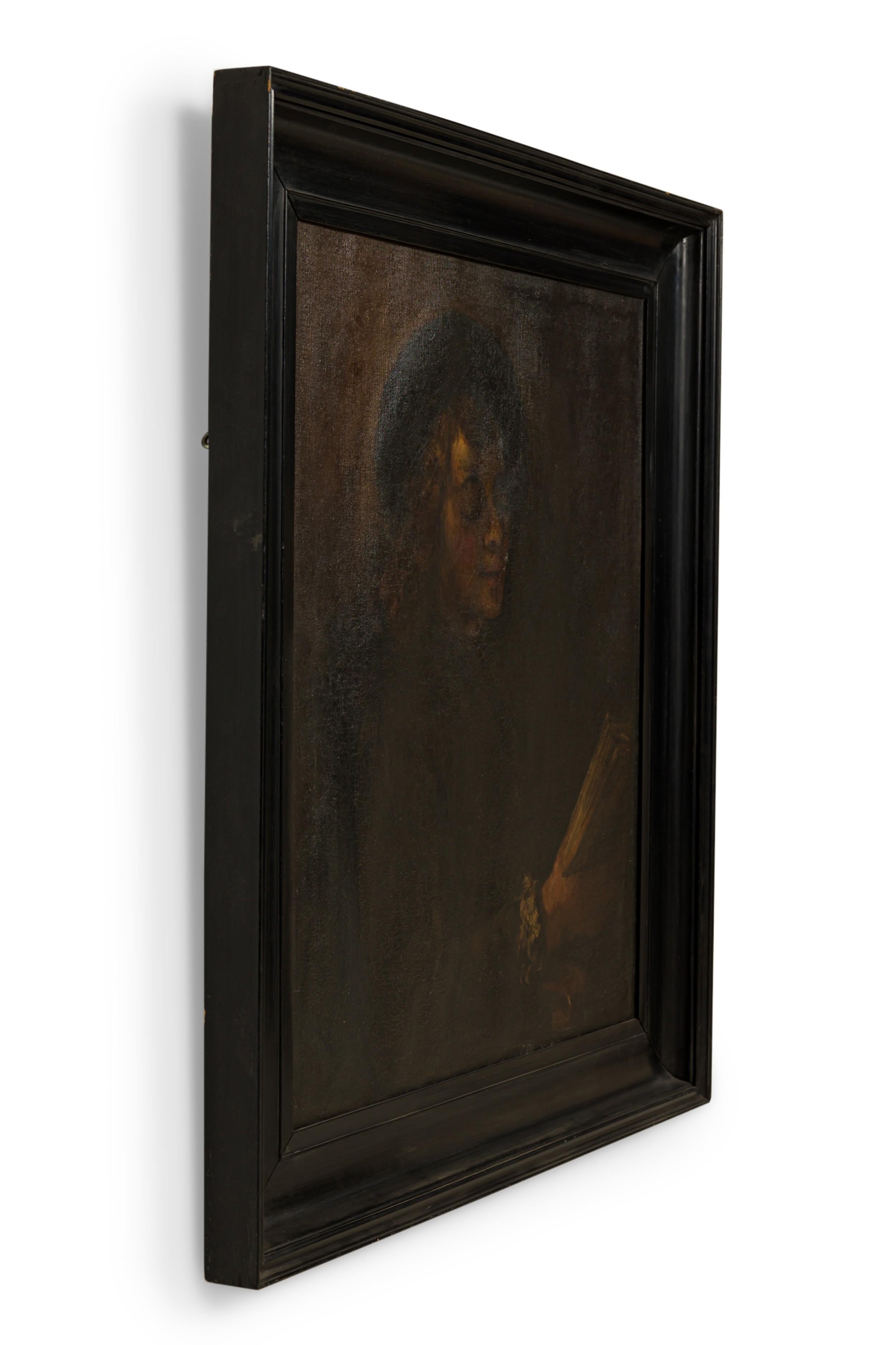 Ebonized  framed oil painting portrait of young boy holding book