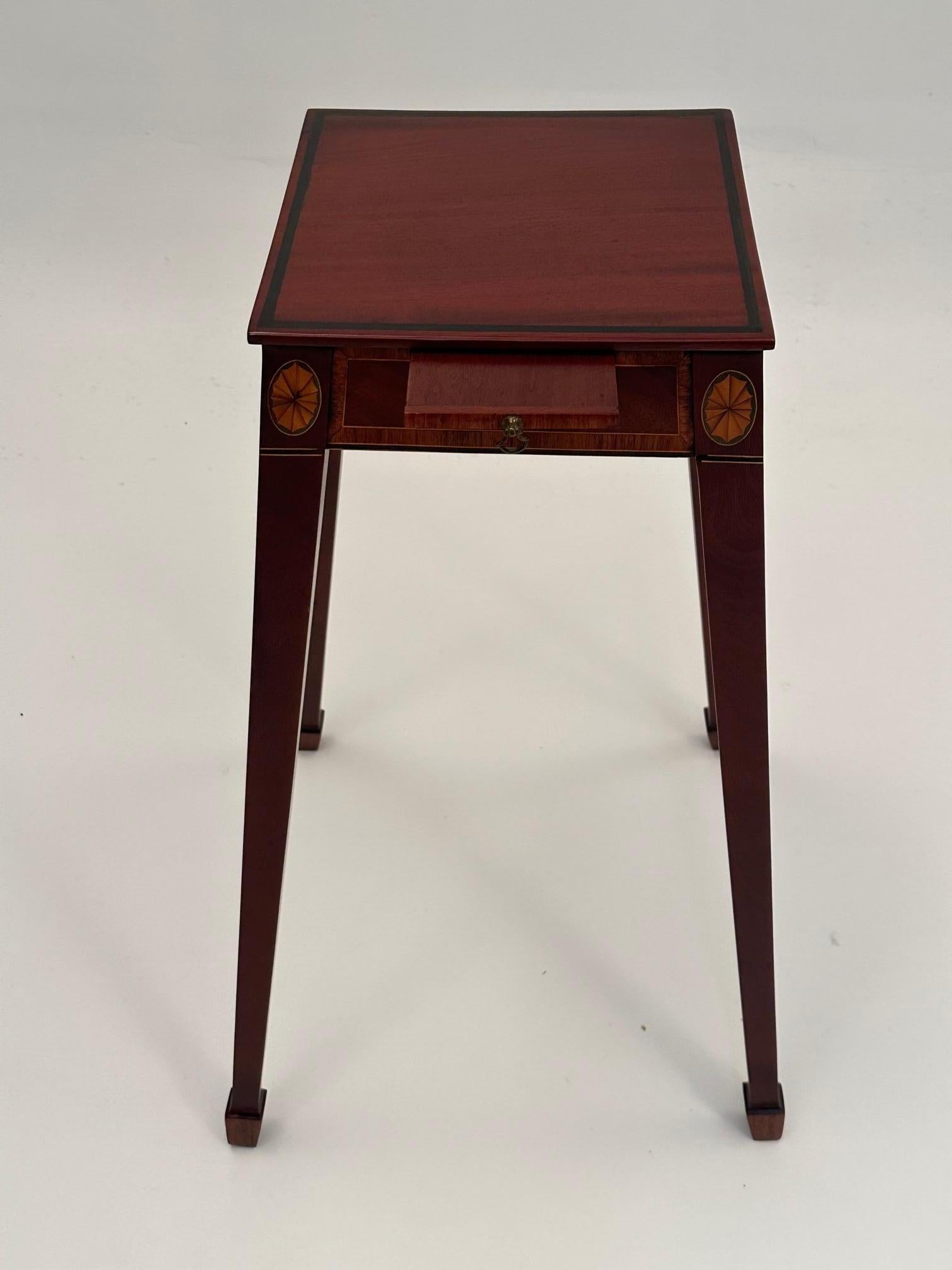 Lovely antique mahogany stand or delicate end table having splayed legs, satinwood inlay on the 11 x 11 top, and single candle slide.