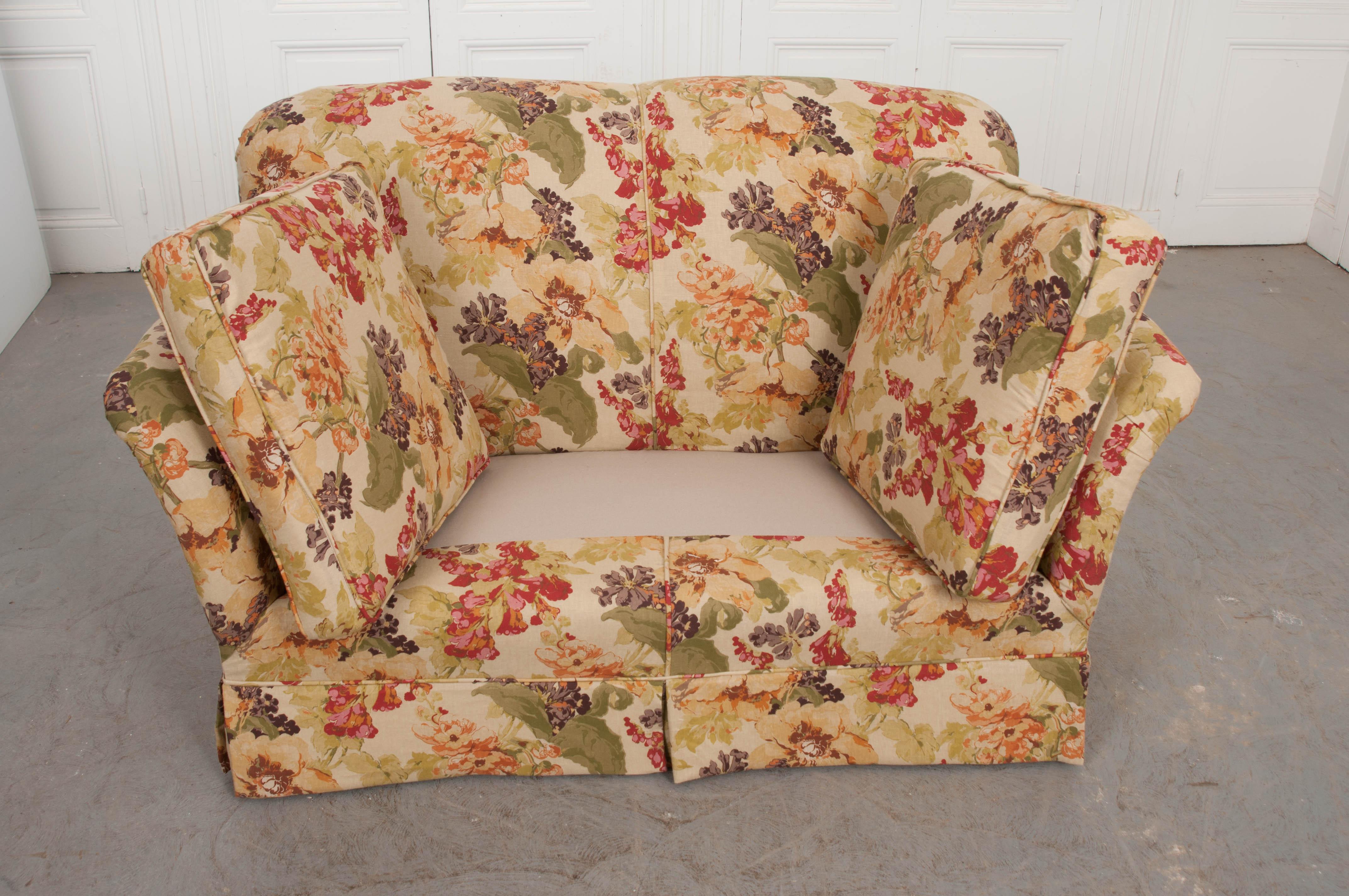 This incredibly comfortable settee loveseat is from England, circa 1930s, and is freshly upholstered in RM CoCo floral fabric, pattern 2156CB, color red S30, 55% linen, 45% viscose.

 
