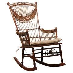 English Used Stick Back Rocking Chair with Woven Rattan Accents and Spheres