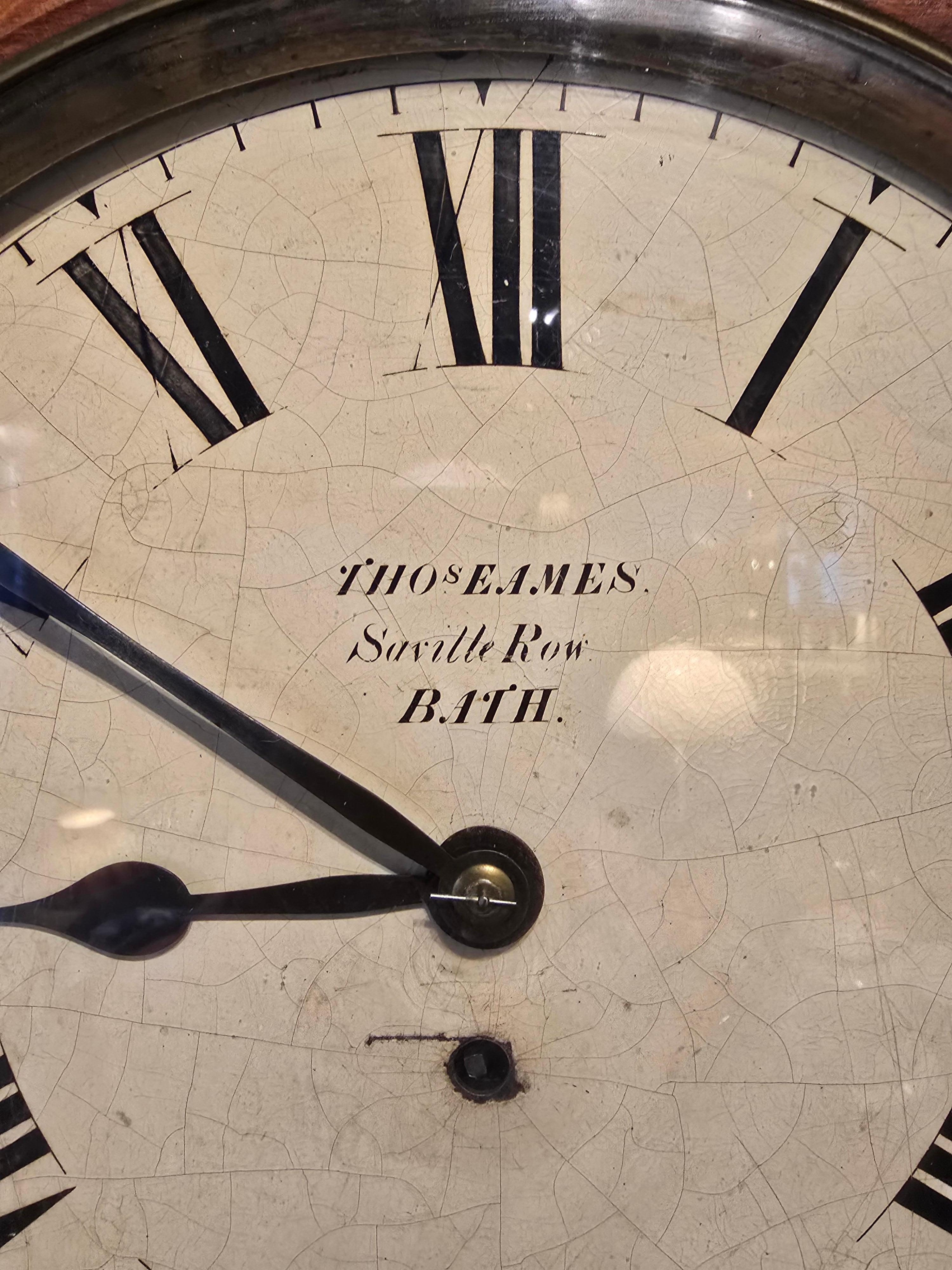 English Wall Clock from the 1800s.  The clock is in good working order and unrestored original condition.  This English wall clock has a fussee movement, which led to far better timekeeping.

Thomas Eames the clockmaker, was registered as trading