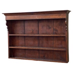English Wall Hanging Shelves of Patinated Oak with Canopy Top and Ogee Sides