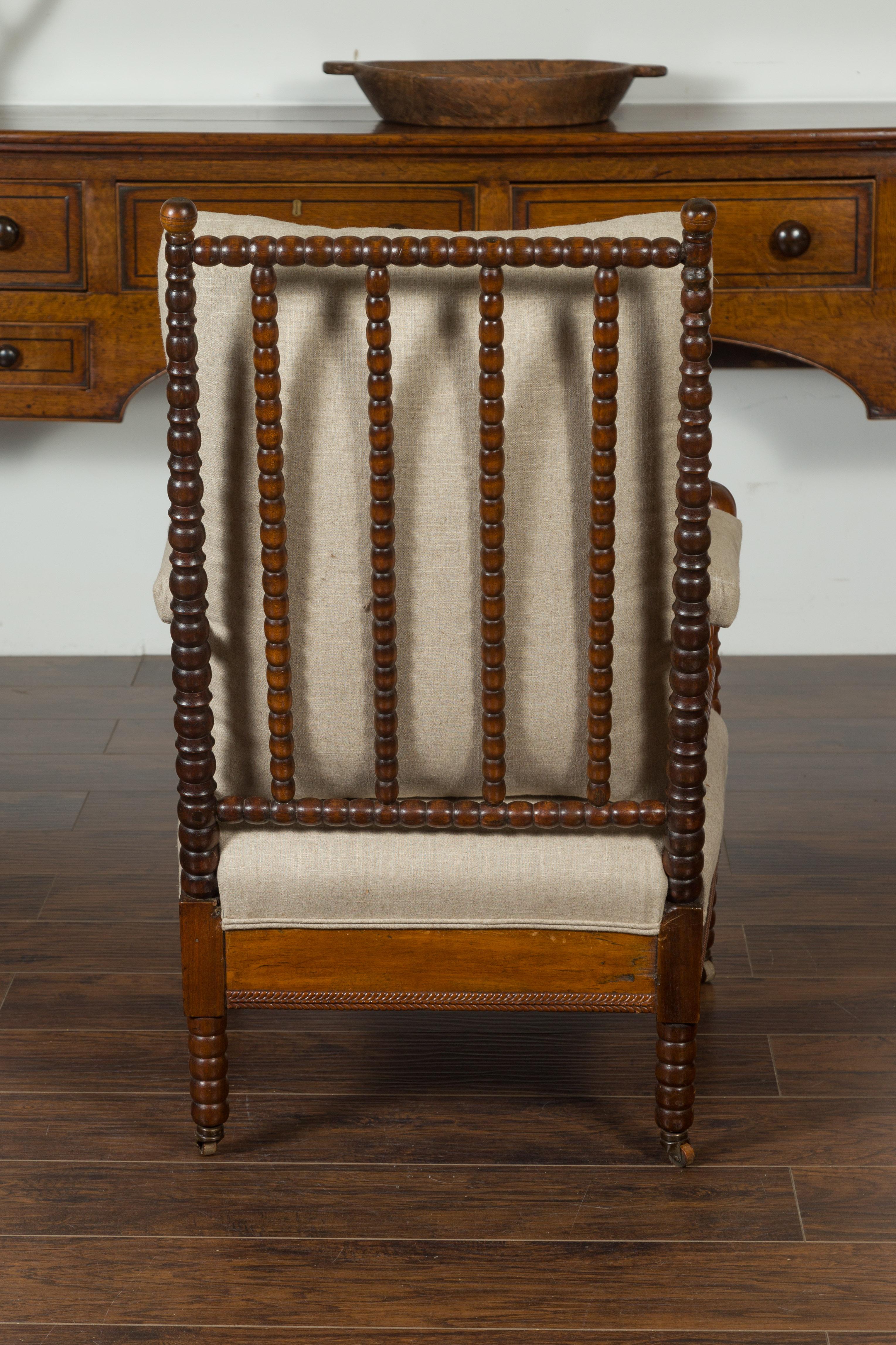 English Walnut Bobbin Armchair with New Upholstery and Casters, circa 1920 8