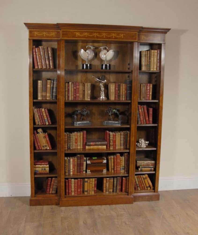 - Stunning English Regency style breakfront bookcase with Sheraton inlay
- Stands in at nearly seven feet tall so an impressive piece
- Classic pediment top with hand carved details
- Intricate marquetry inlay work includes Sheraton motifs and