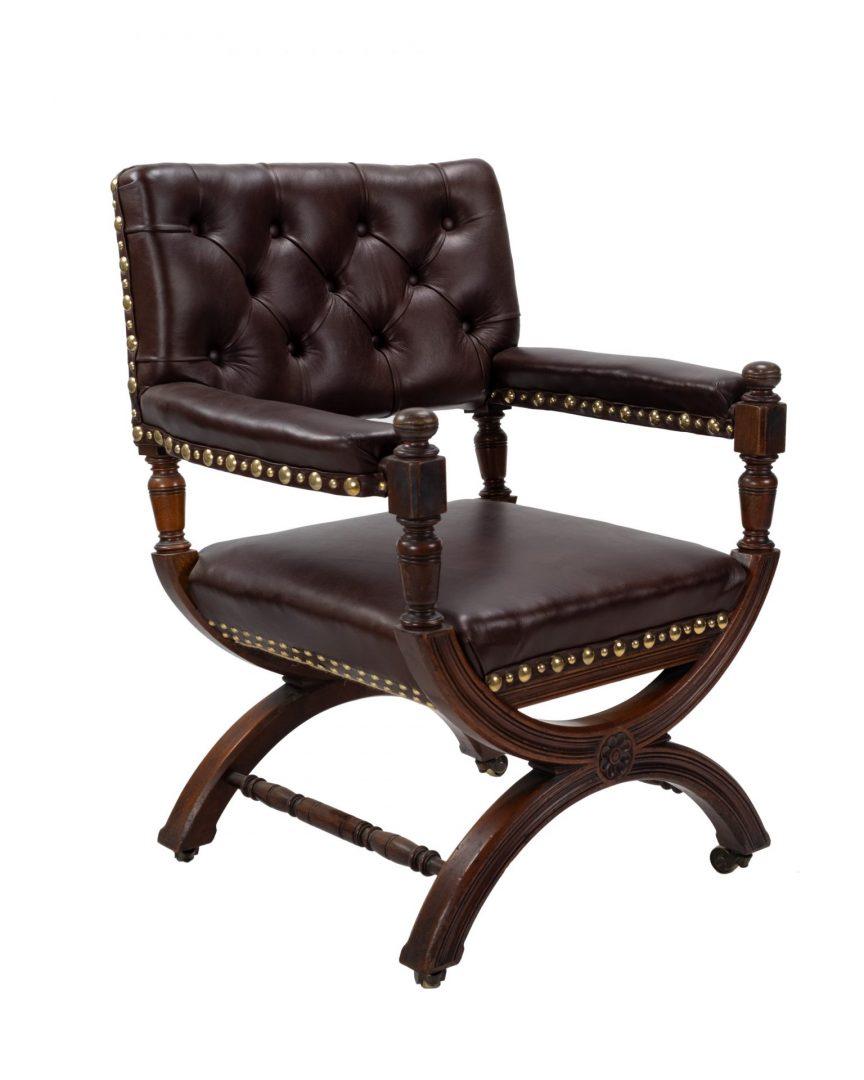 A Victorian cruel style library or armchair, similar to an original design by Thomas Hope. We consider that this chair was probably made by Gillows in walnut and it has been recovered in maroon leather.



Dimensions 54cm deep x 70cm deep x 89cm