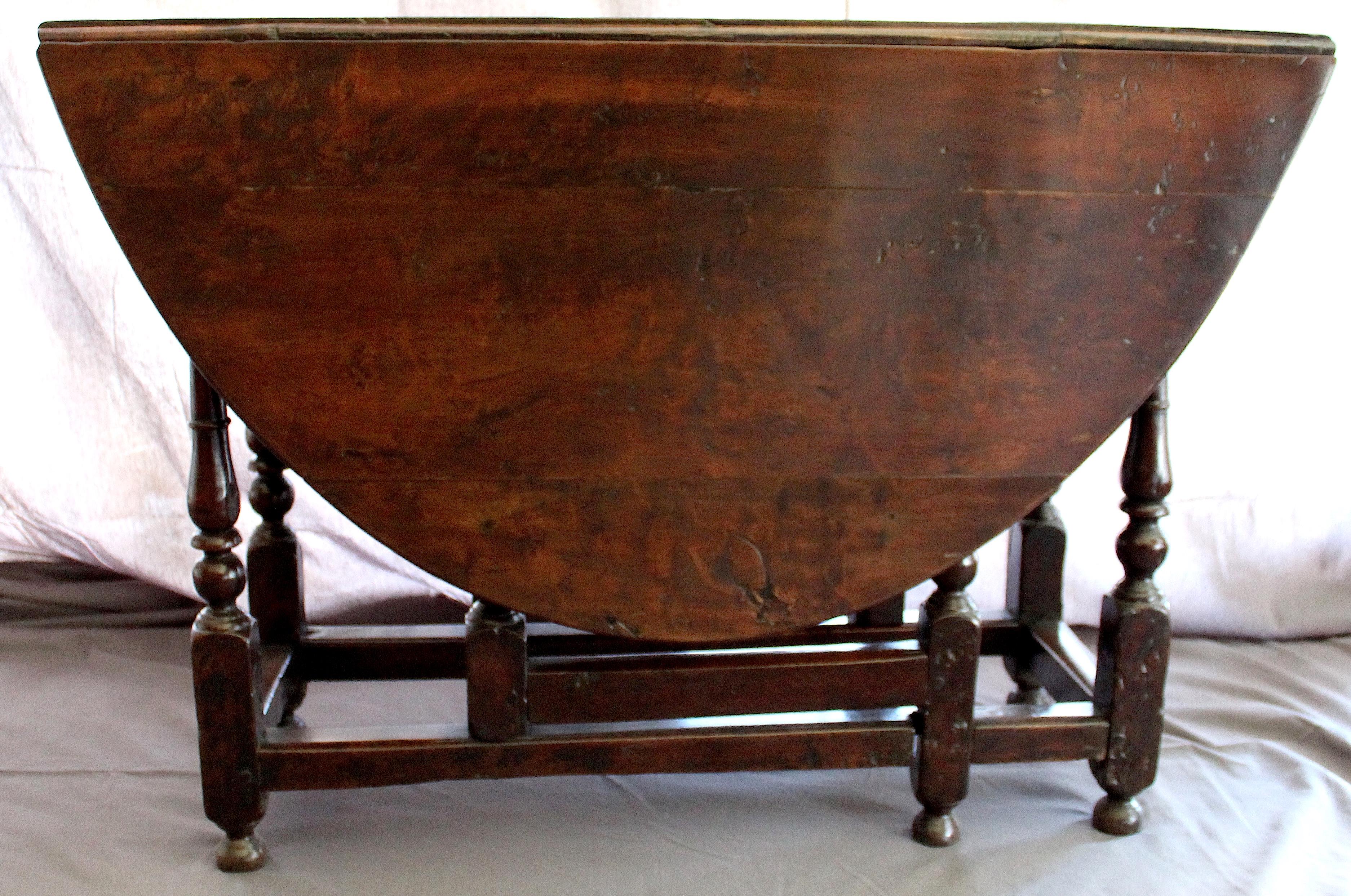 English walnut hate leg table circa 1685
A beautiful example of early English furniture with lovely color, beautiful ageing and with centre panel two drop leaves and carved folding legs beneath.