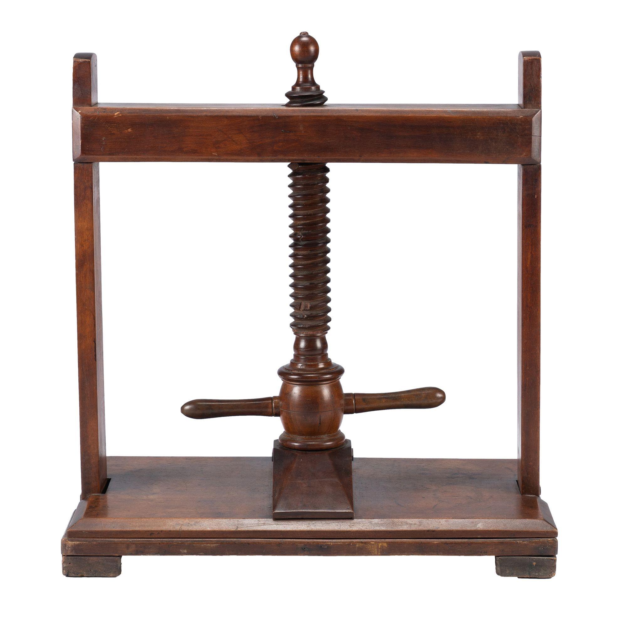 Black walnut double handled linen press with turned column and acorn finial. Thomas Bradford was a leading English manufacturer of washing machines, mangles, wringers, drying closets, and linen presses, with stores in London, Manchester, Salford,