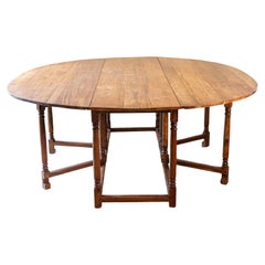English Walnut Oval Top Drop-Leaf Gateleg Table with Turned Legs and Stretchers