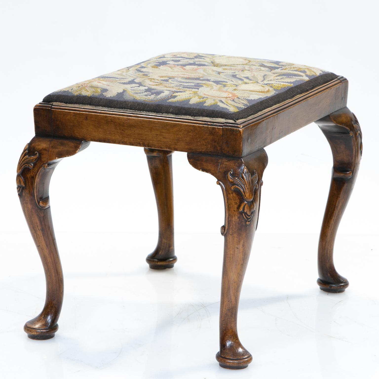 English walnut stool

An excellent English walnut stool with needlepoint covering. The frame is strong and sturdy. There are four cabriole legs with carved knees and scrolls and ending with pad feet. Beautiful patina and color of the walnut.