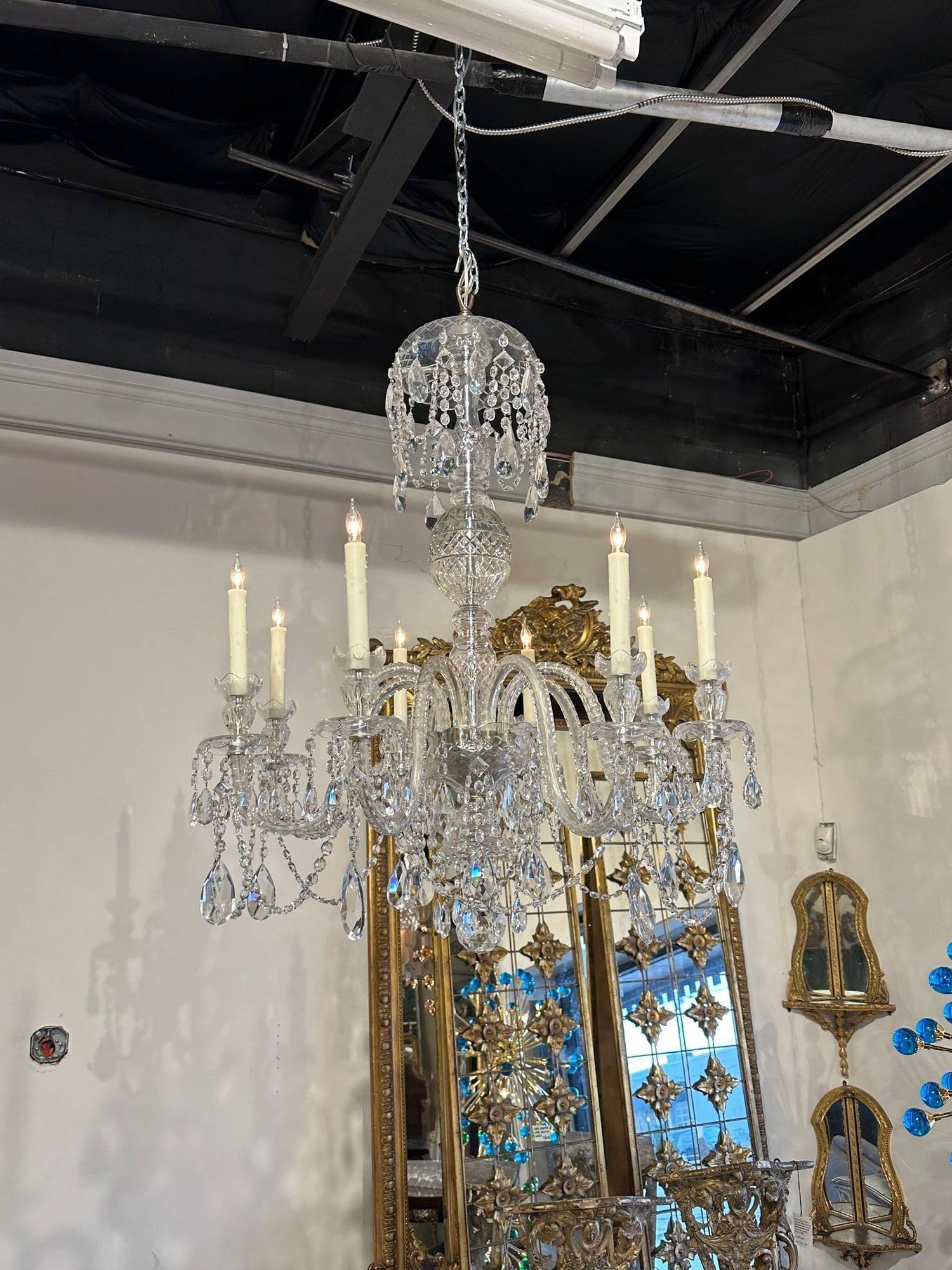 Gorgeous 19th century English Waterford style 8-light chandelier. circa 1900. The chandelier has been professionally rewired, comes with matching chain and canopy. It is ready to hang!