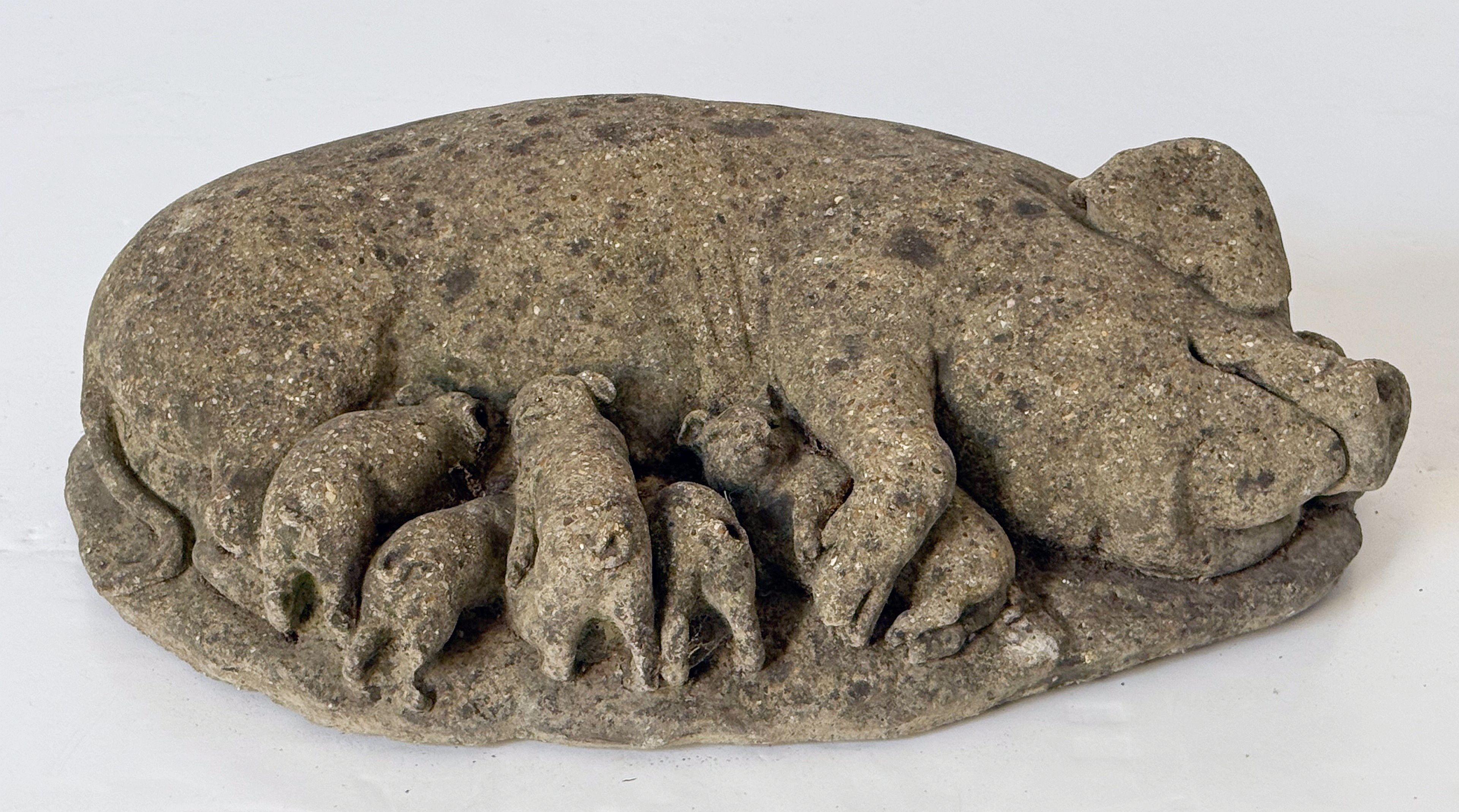 A handsome vintage English garden figural statuary sculpture of weathered composition stone, featuring a recumbent mama pig with piglets.

Perfect for a garden or patio.

