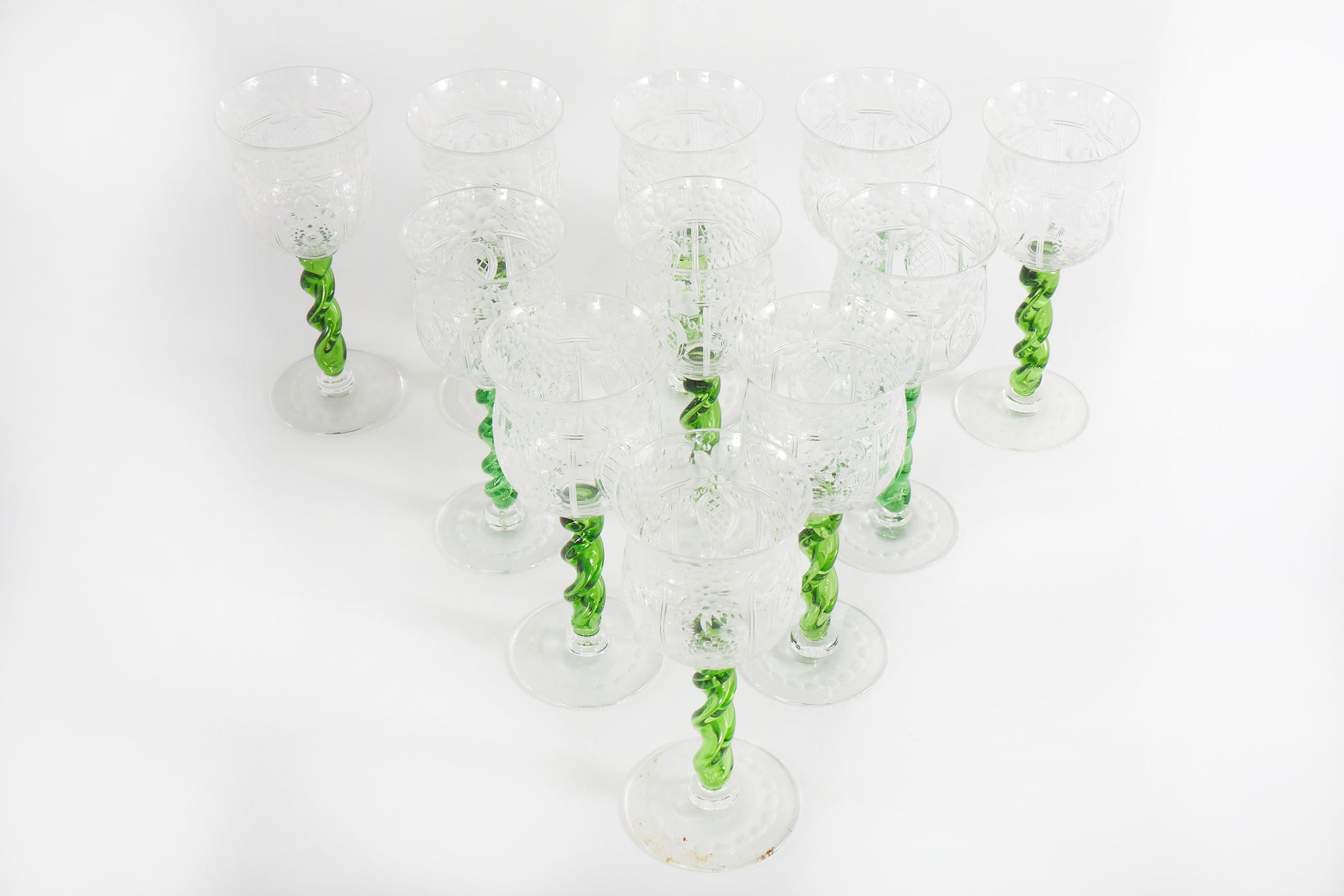 Mid 19th century English etched floral design with swirl green holding stem crystal barware / tableware wine / water glassware service for ten people. Each glass is in great condition and undersigned by the maker. Each one stand about 8 inches high