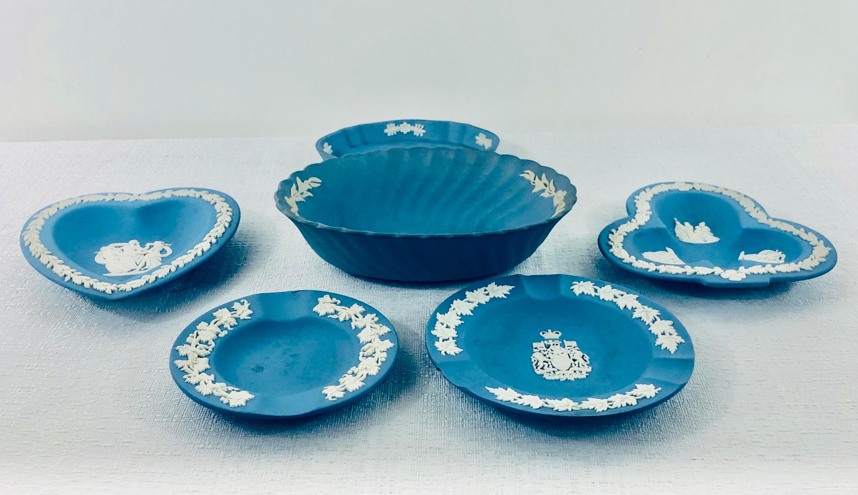 A set of 6 English Wedgwood Jasperware decorative plates in “Wedgwood Blue”. Each piece features a white design depicting high relief acanthus leaves and white sprigged reliefs. 

About Jasperware: Jasperware, or jasper ware, is a type of pottery