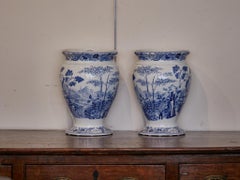 English Wedgwood Blue Palissade Lidded Urns with Chinoiserie Gardens, a Pair