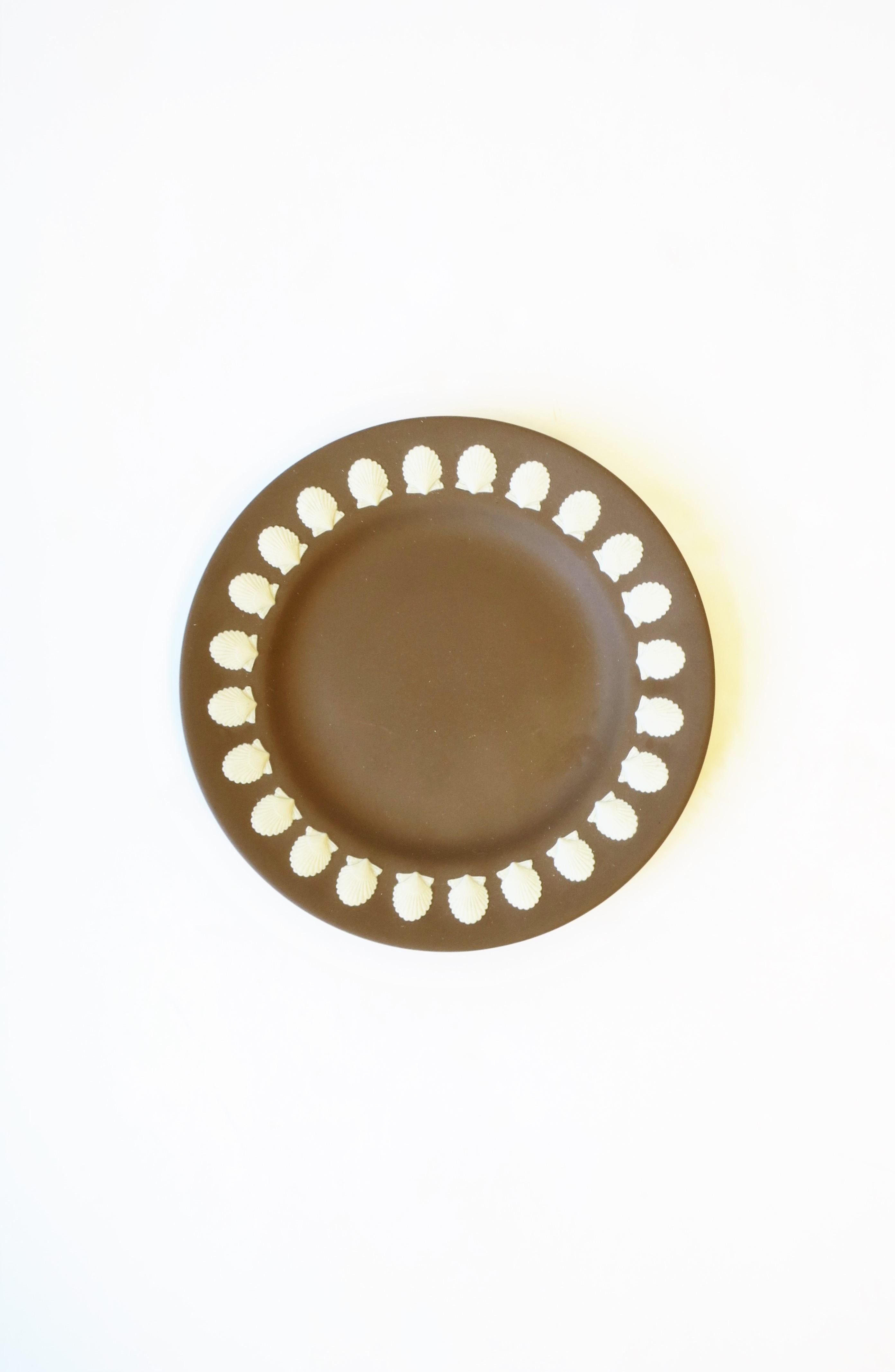 A beautiful English Wedgwood Jasperware plate or dish with scallop seashell design, circa 20th century, England. This piece is a matte stoneware in mocha brown or light brown with a white scallop seashell design around edge. Beautiful as a