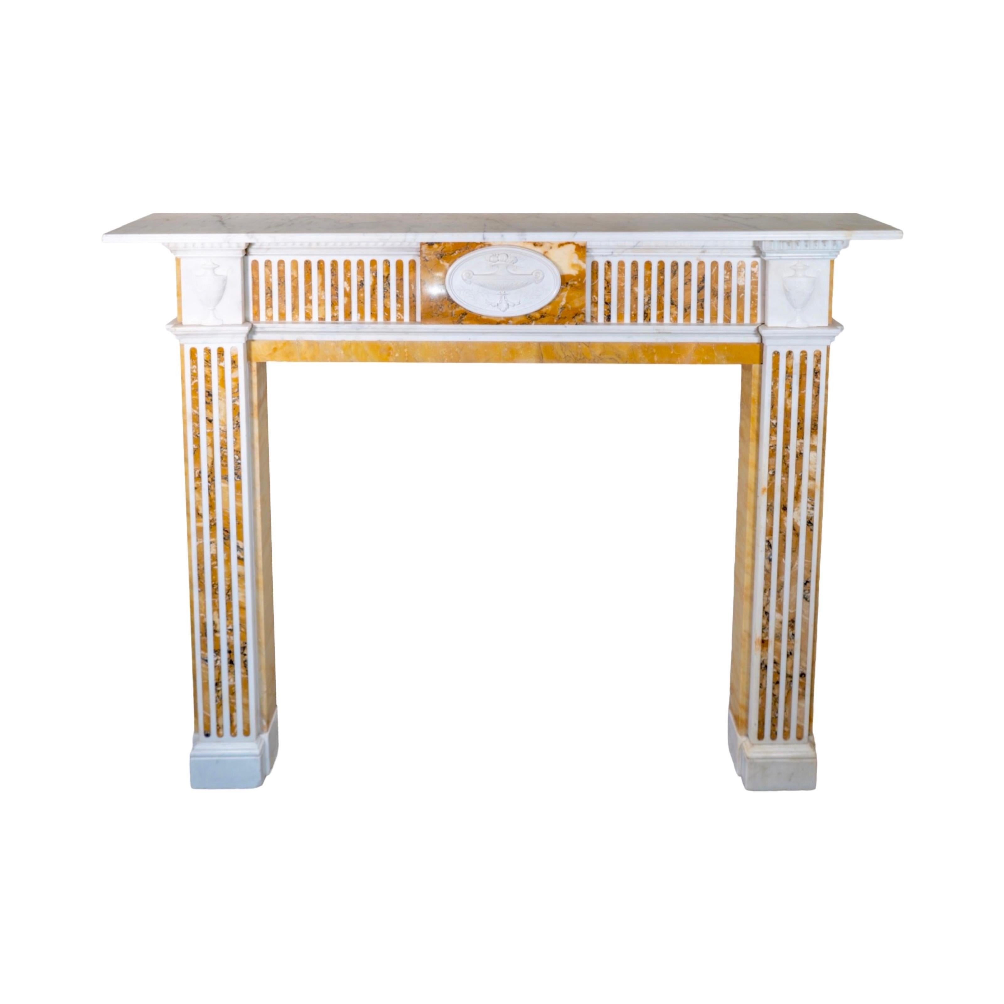 Elevate your fireplace with this exquisite antique English Brocatelle de Sienna Marble Mantel. Crafted with a mix of White veined carrara marble and Jaune de Valence marble, this mantel exudes elegance and luxury. Dating back to the 1850s, it