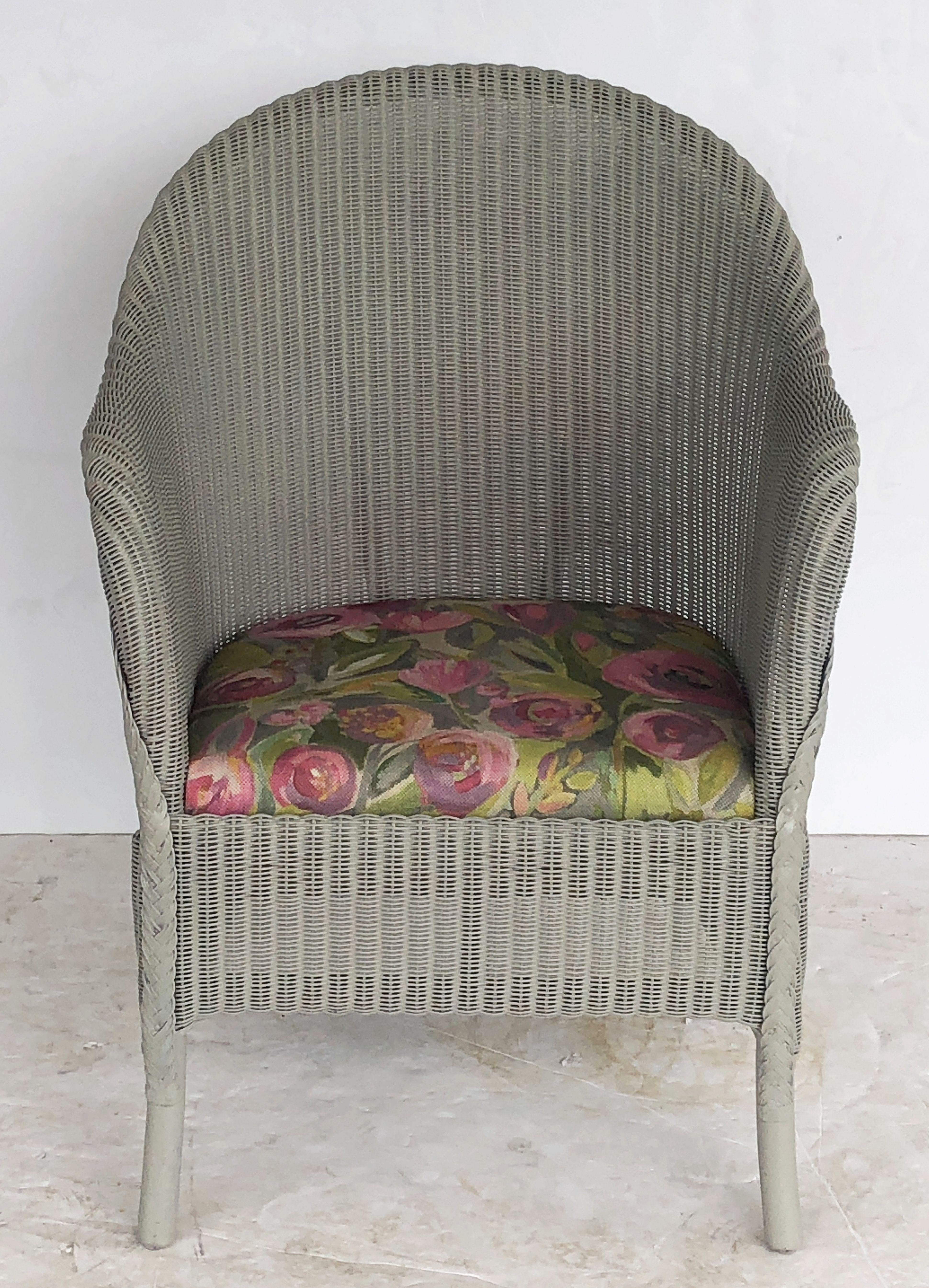 A Lloyd Loom lounge chair, synonymous with classic English style, featuring a flowing, arched back of woven wicker and wire over a wood frame, with a drop-in upholstered cushion.

Perfect for an indoor or outdoor garden room, garden or conservatory,