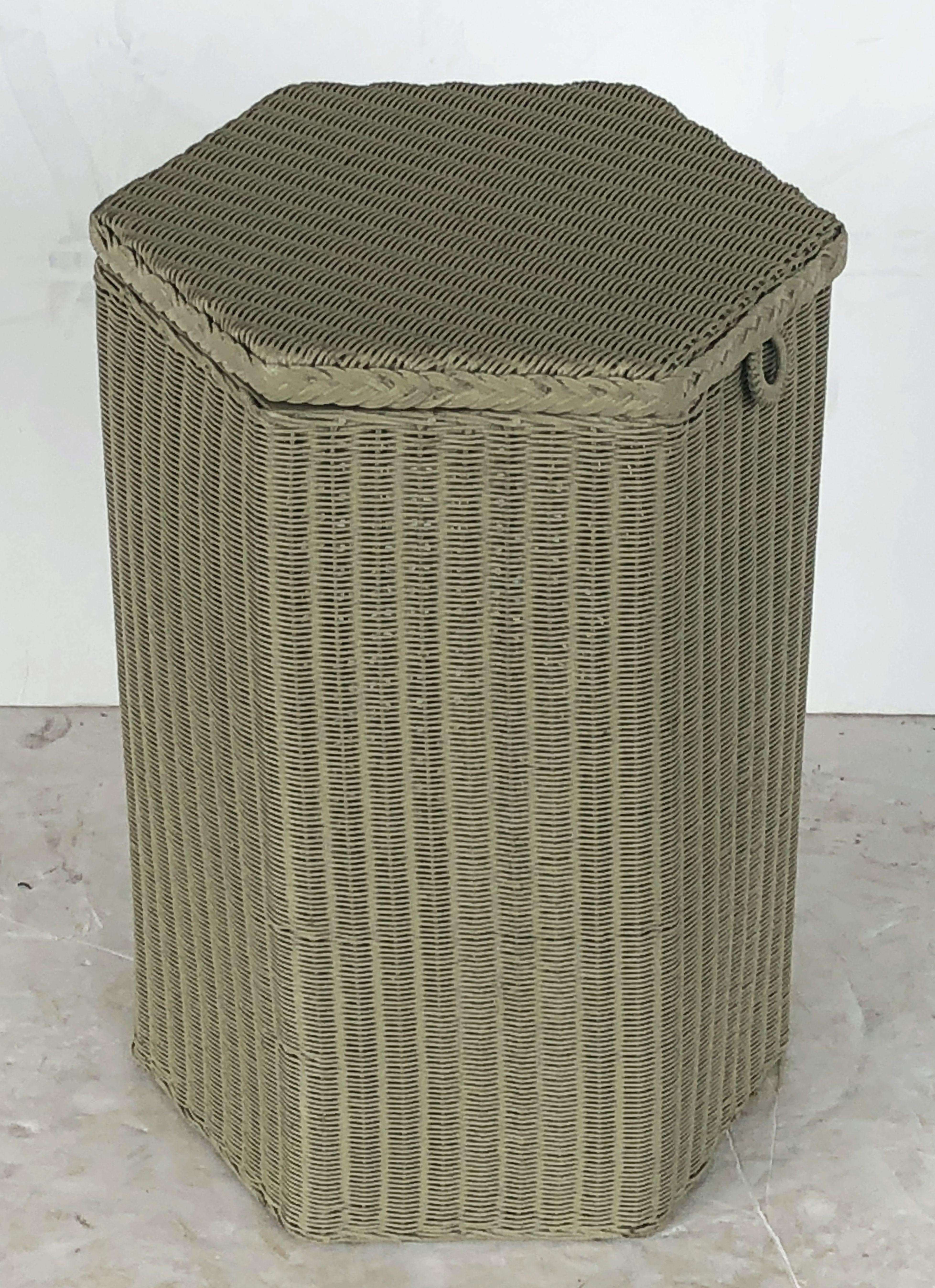 A fine Lloyd Loom hexagonal linen hamper or basket, synonymous with Classic English style, featuring a tall six-sided hamper with hinged lid of woven wicker and wire over a wood frame stretcher.

Perfect for an indoor or outdoor garden room, garden,