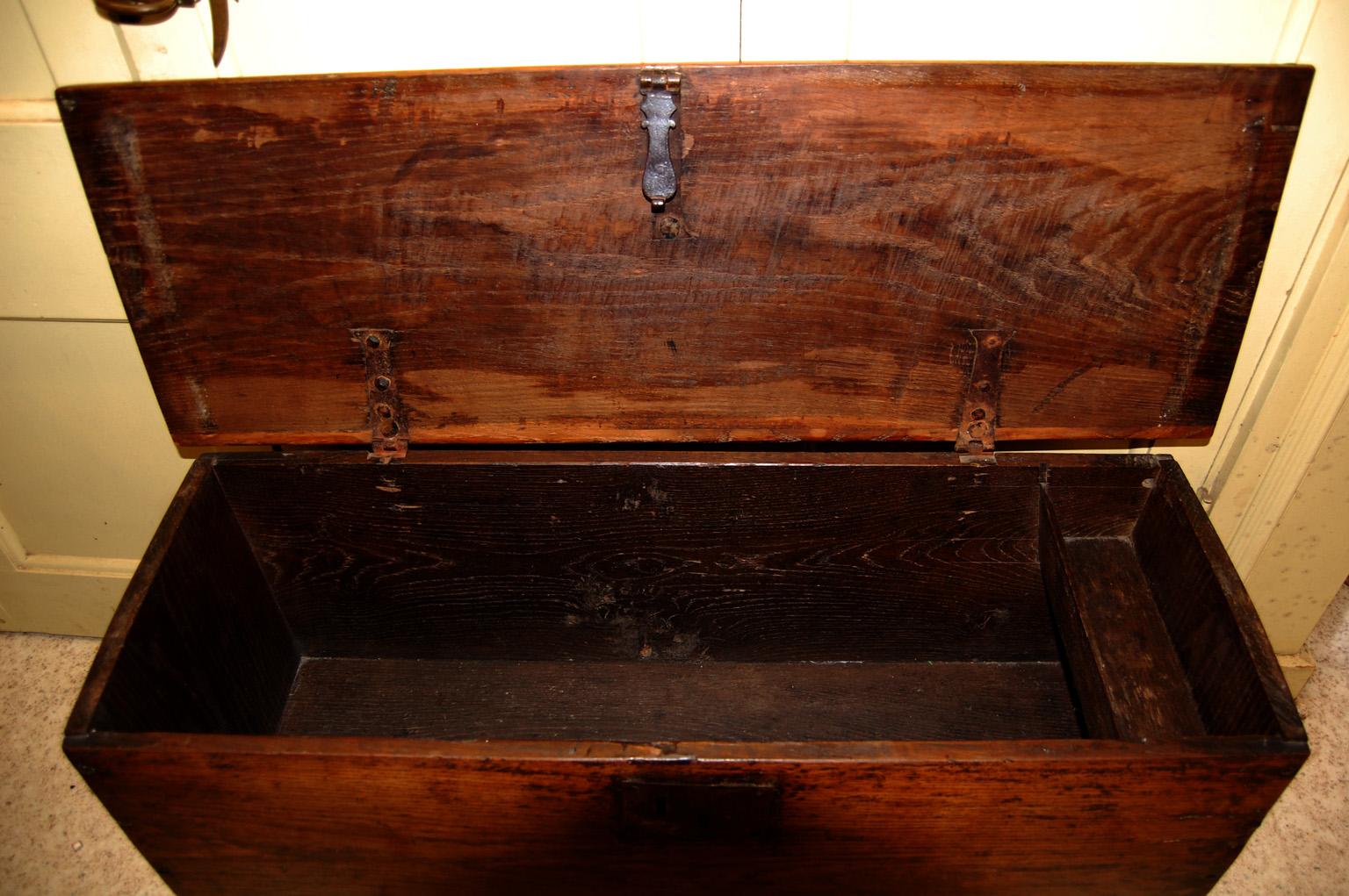 
 English William and Mary oak six plank coffer with shaped boot jack ends, interior till, molded top with chip carved edge and iron lock (no key).  The chip carved ends and  hand molded front edge along with the gracefully carved bootjack ends and