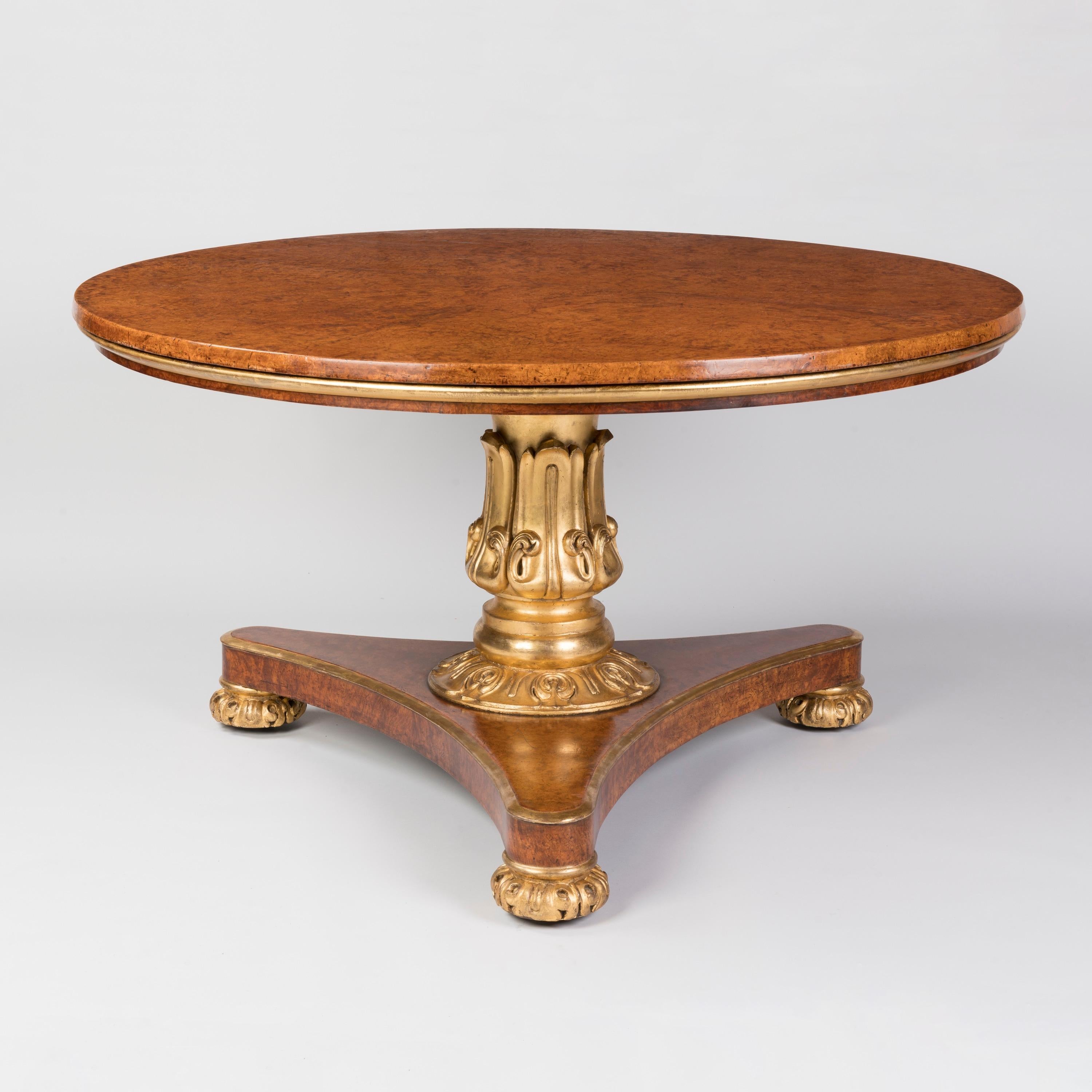 A William IV Period Parcel Gilt Burr Elm Centre Table
Attributed to Thomas & George Seddon

The circular table veneered throughout with finely figured burr elm and relieved with parcel gilding throughout, the top with a tilting mechanism and a