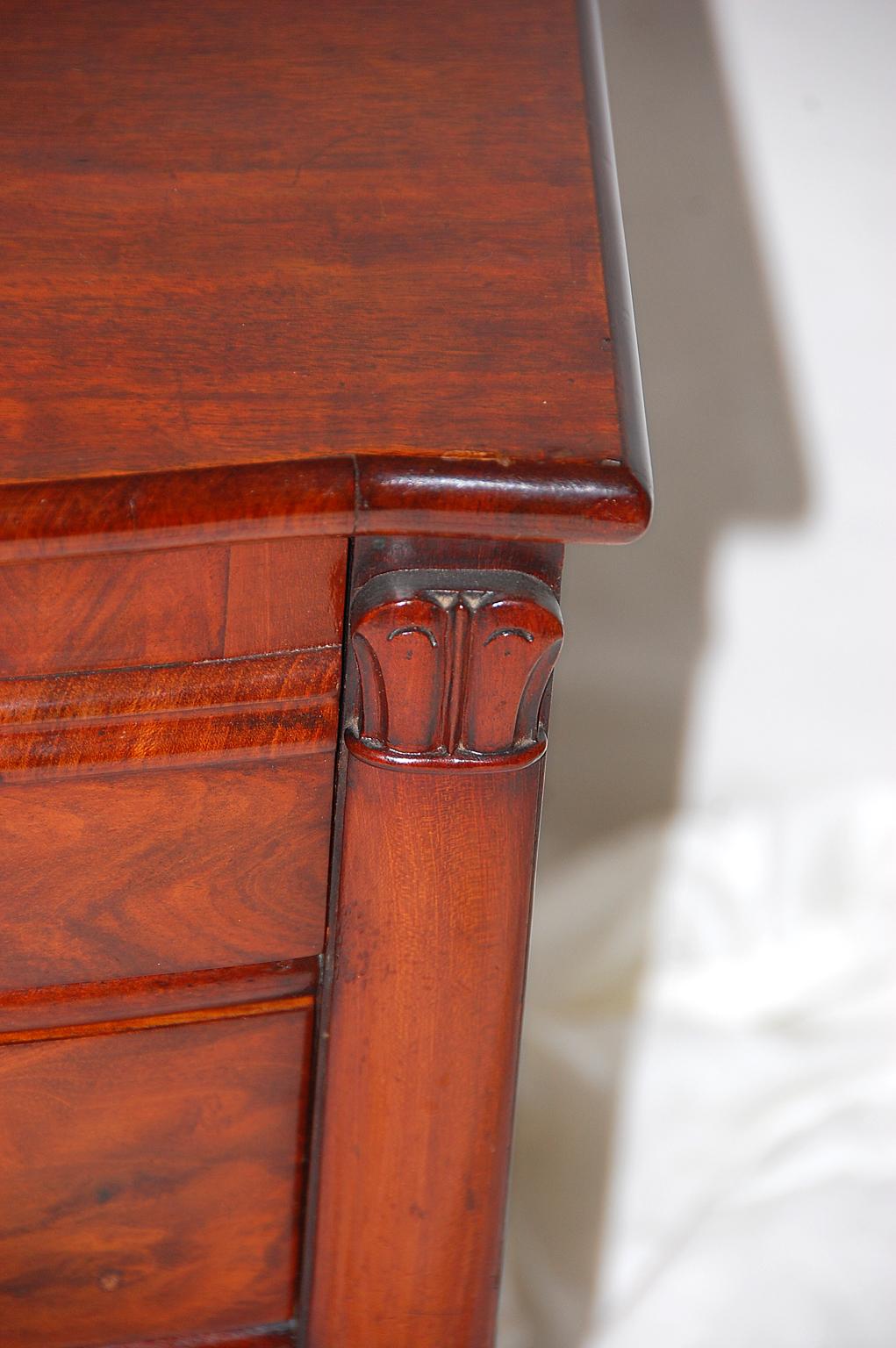 English William IV Period mahogany dwarf chest of four drawers with bowfront breakfront form, columns and bun feet. This chest has fine quality timber and sophisticated design and would be suitable for jewelry, watches, a small collection or sewing