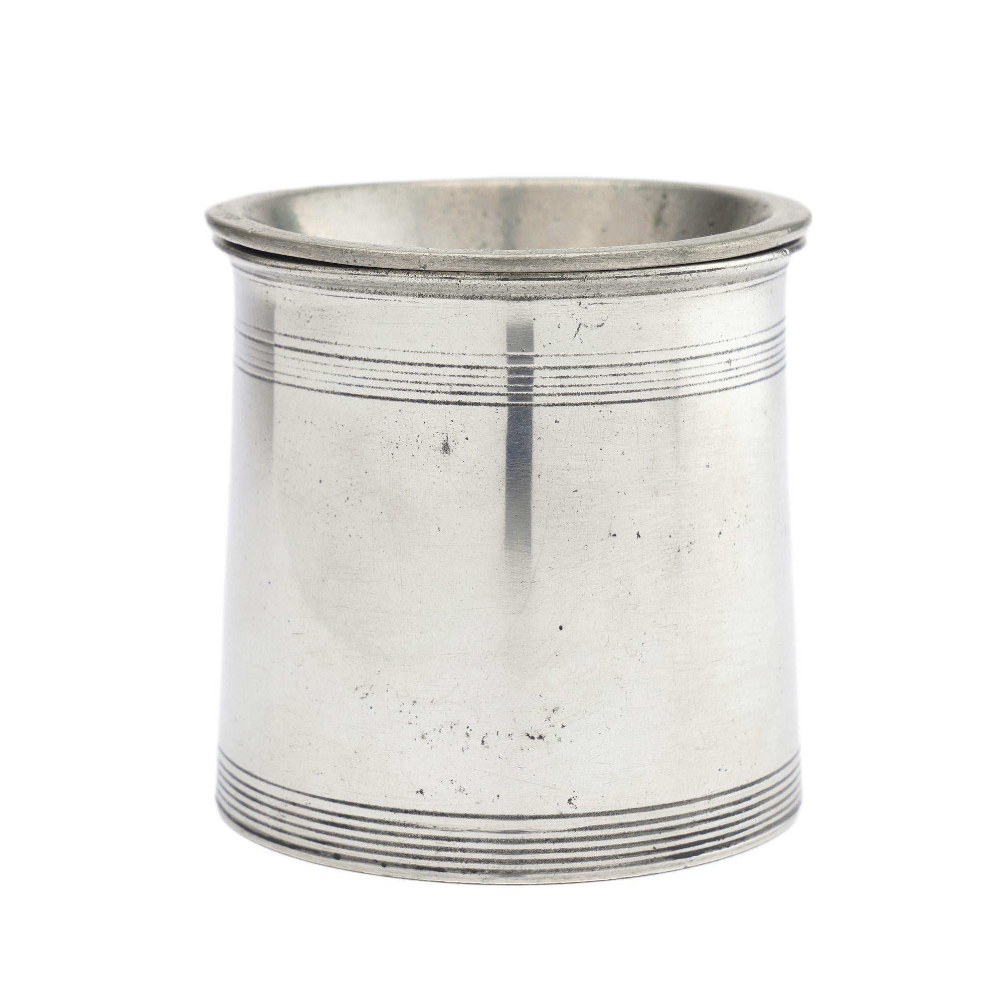 English William IV polished pewter open canister with engine turned scoring on the top and bottom rims. Unmarked. The condition is polished with wear to the base consistent with age & use. 
England, early 19th century.