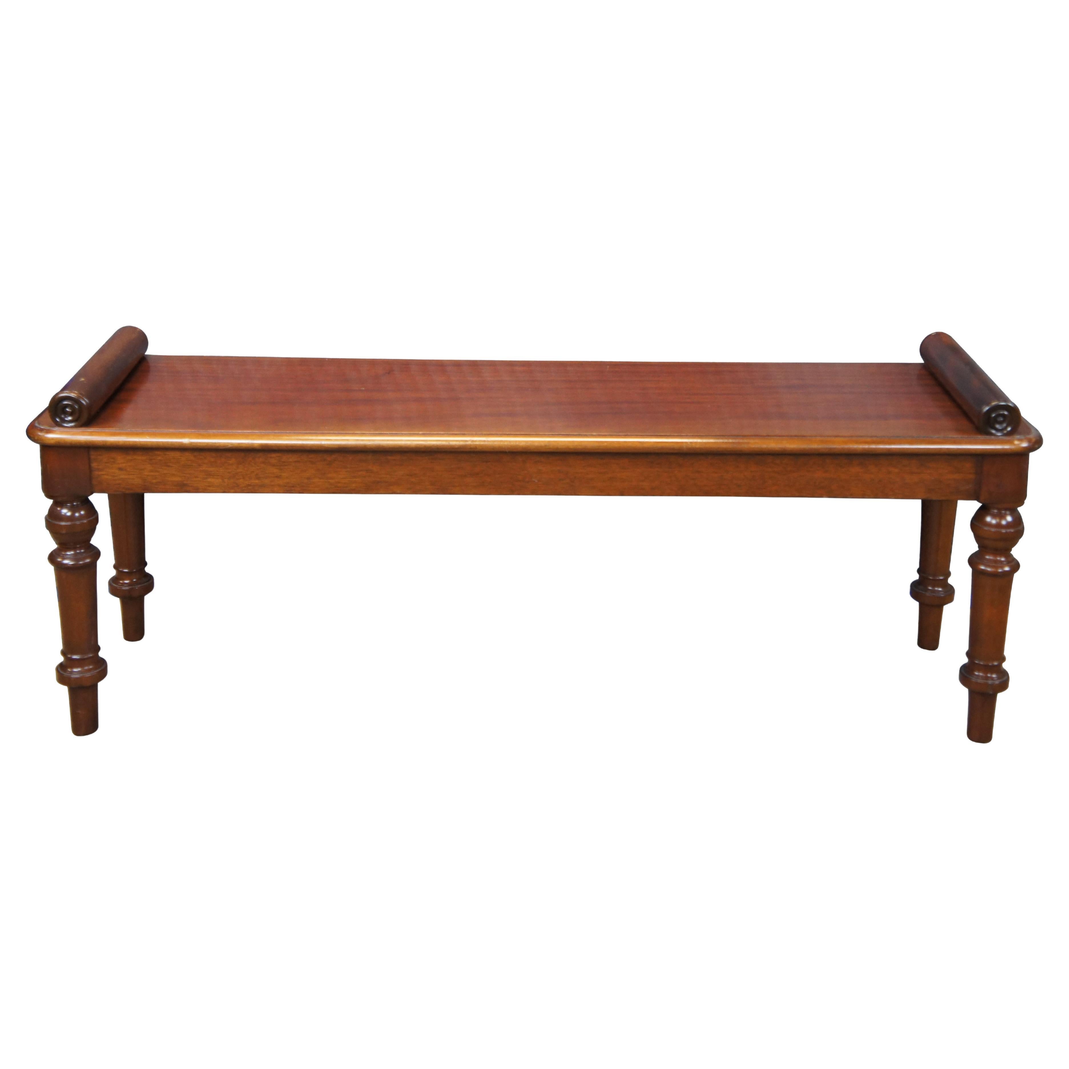 Vintage mahogany window seat / hall bench featuring English William IV / Regency styling with scrolled bolster rails and turned legs.  Includes red and gold plaid cushion.

Dimensions:
14