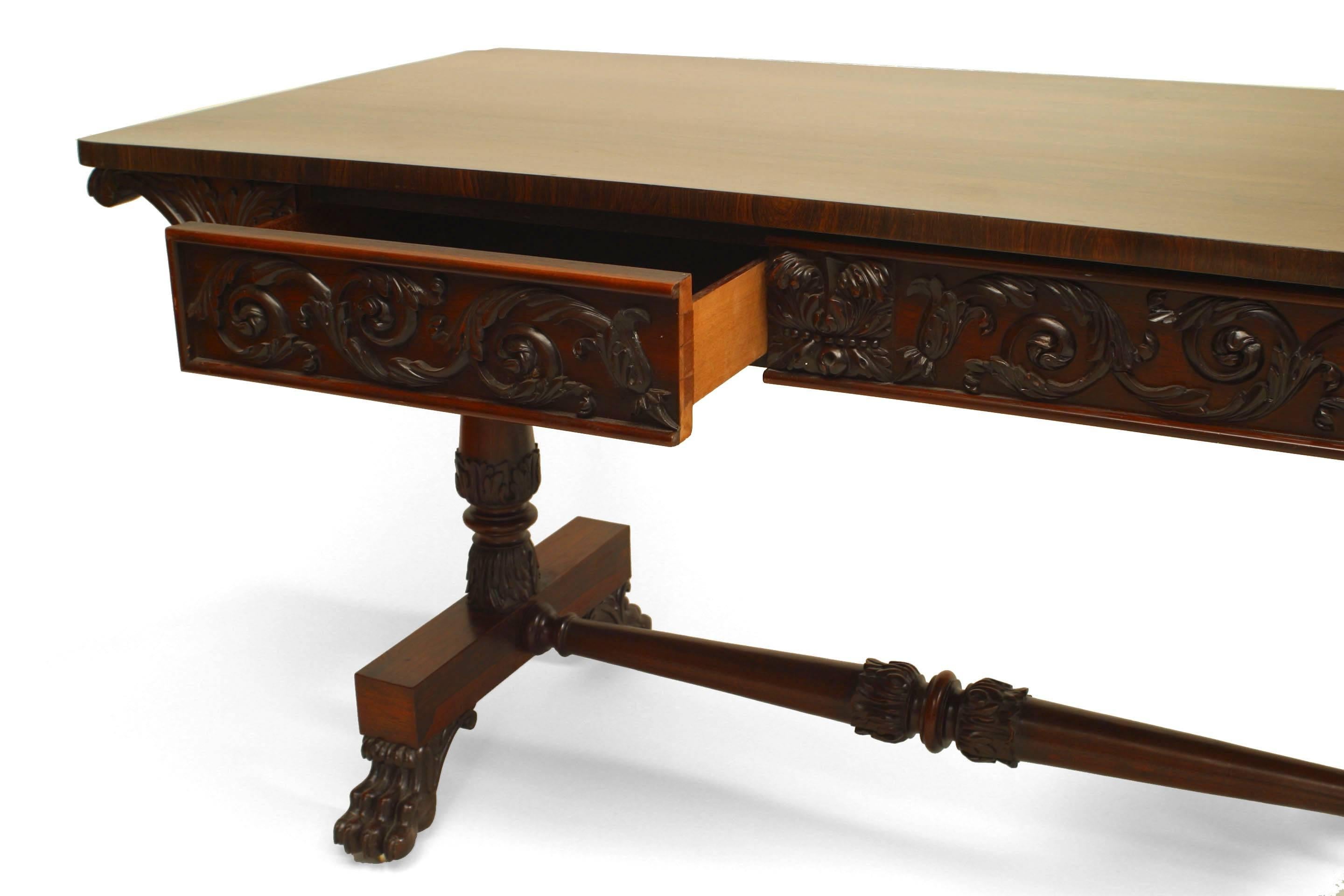 English William IV (circa 1835) rosewood davenport table desk with carved apron and supported on 2 pedestals connected with a stretcher and 2 drawers.
