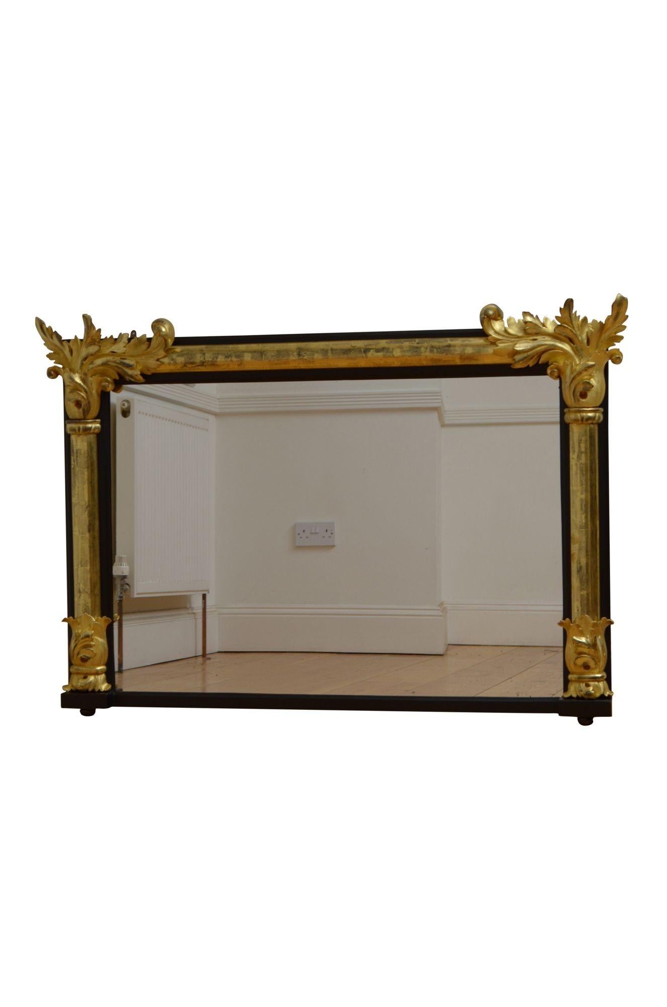 K0545 Very elegant English gilded wall mirror, having an old mirror plate with minor imperfections in ebonised moulded frame with giltwood half columns finish with carved capitals and acanthus leaves to the top corners. This antique mirror is in
