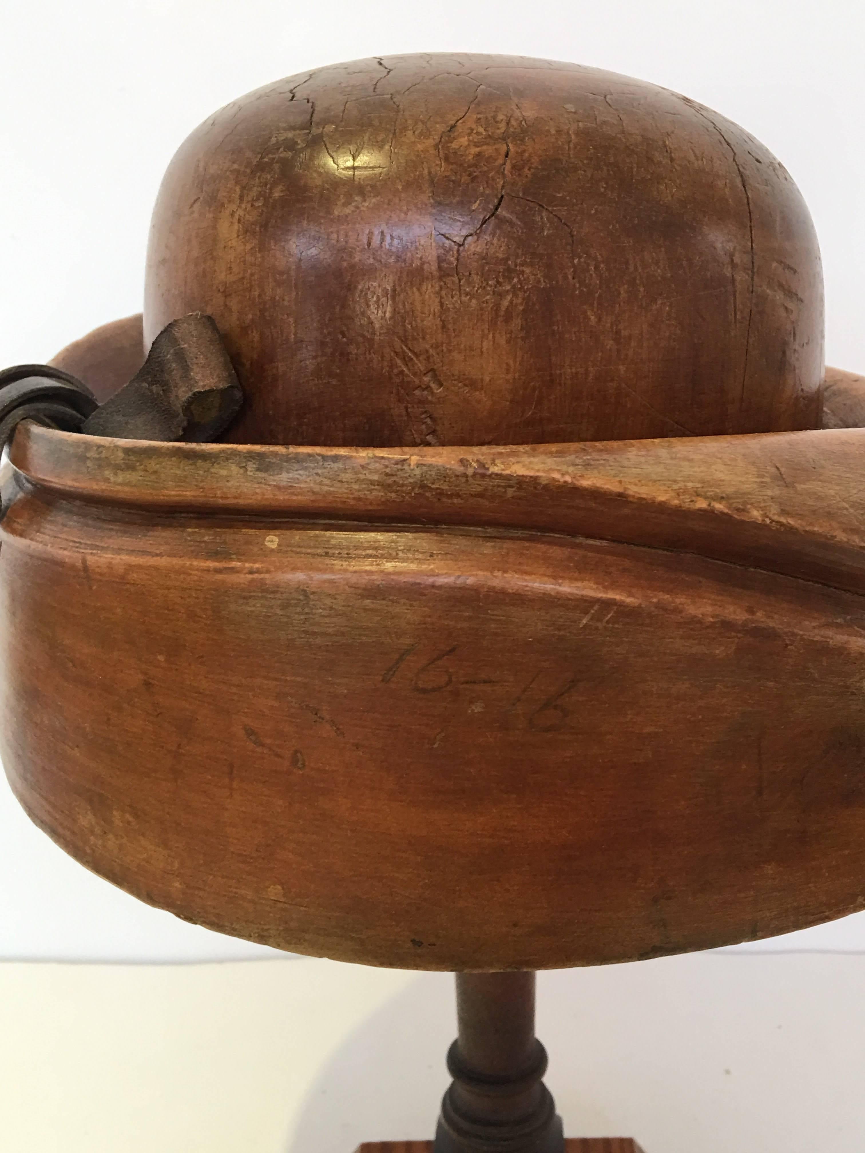 English wood hat mold on wood stand.
Brimmed hat with leather bow
circa 1940s #2476.