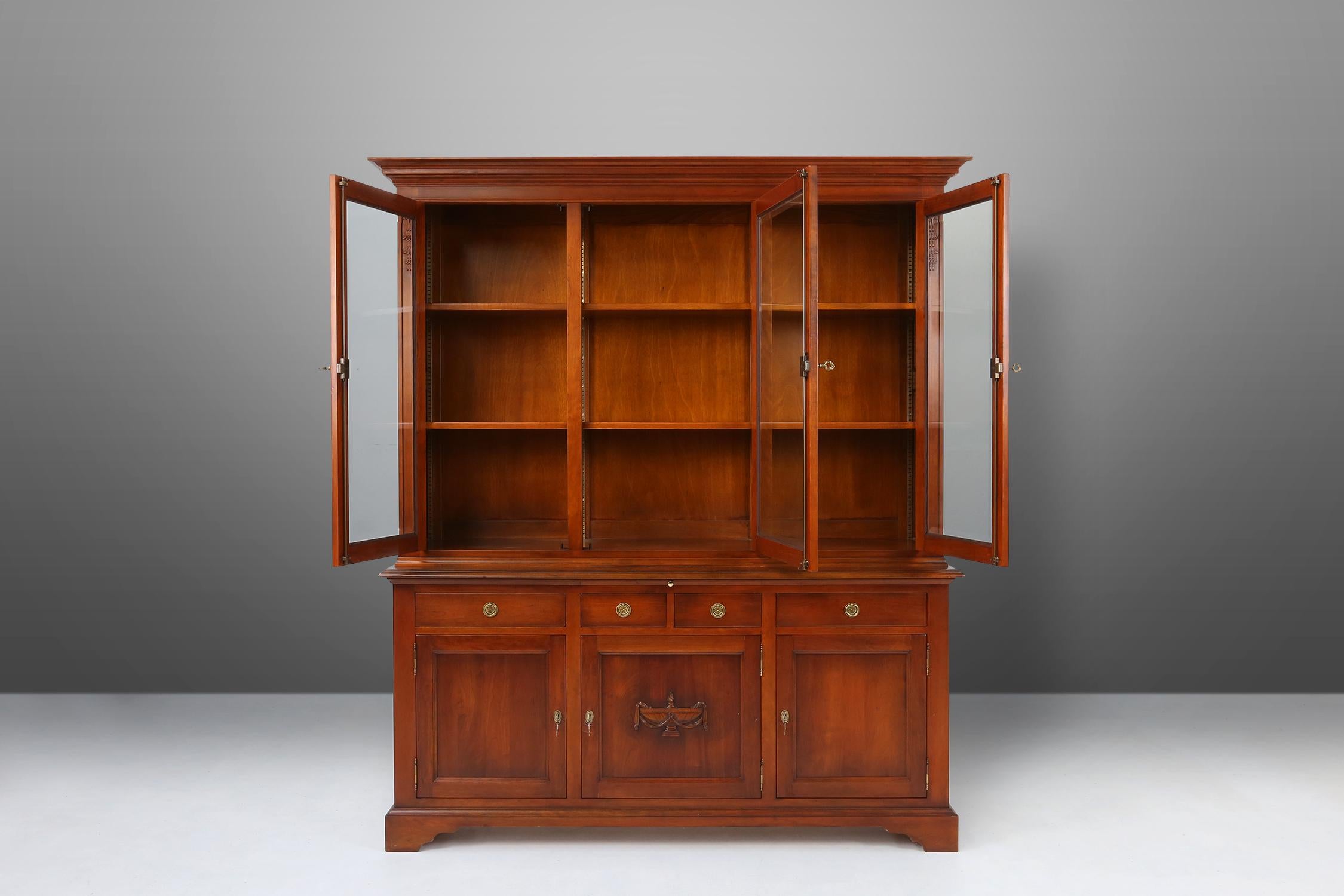 This exquisite bookcase is a true gem that will add a touch of elegance and sophistication to any home. Crafted with attention to detail. Has warm tones and stunning grain patterns. The deep, lustrous finish enhances the natural beauty of the wood,