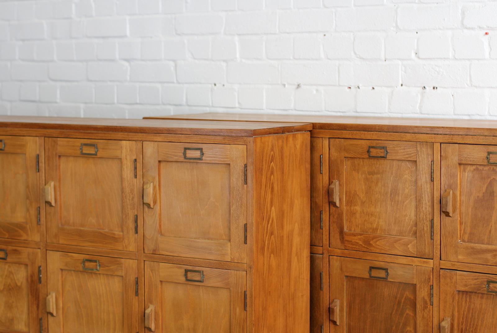 English wooden school lockers, circa 1950s.

- Price is per unit (2 available)
- Solid beech top and sides
- Pine doors with pine handles
- Brass card holders
- 20 compartments
- Salvaged from a primary school in Dorset
- English, circa