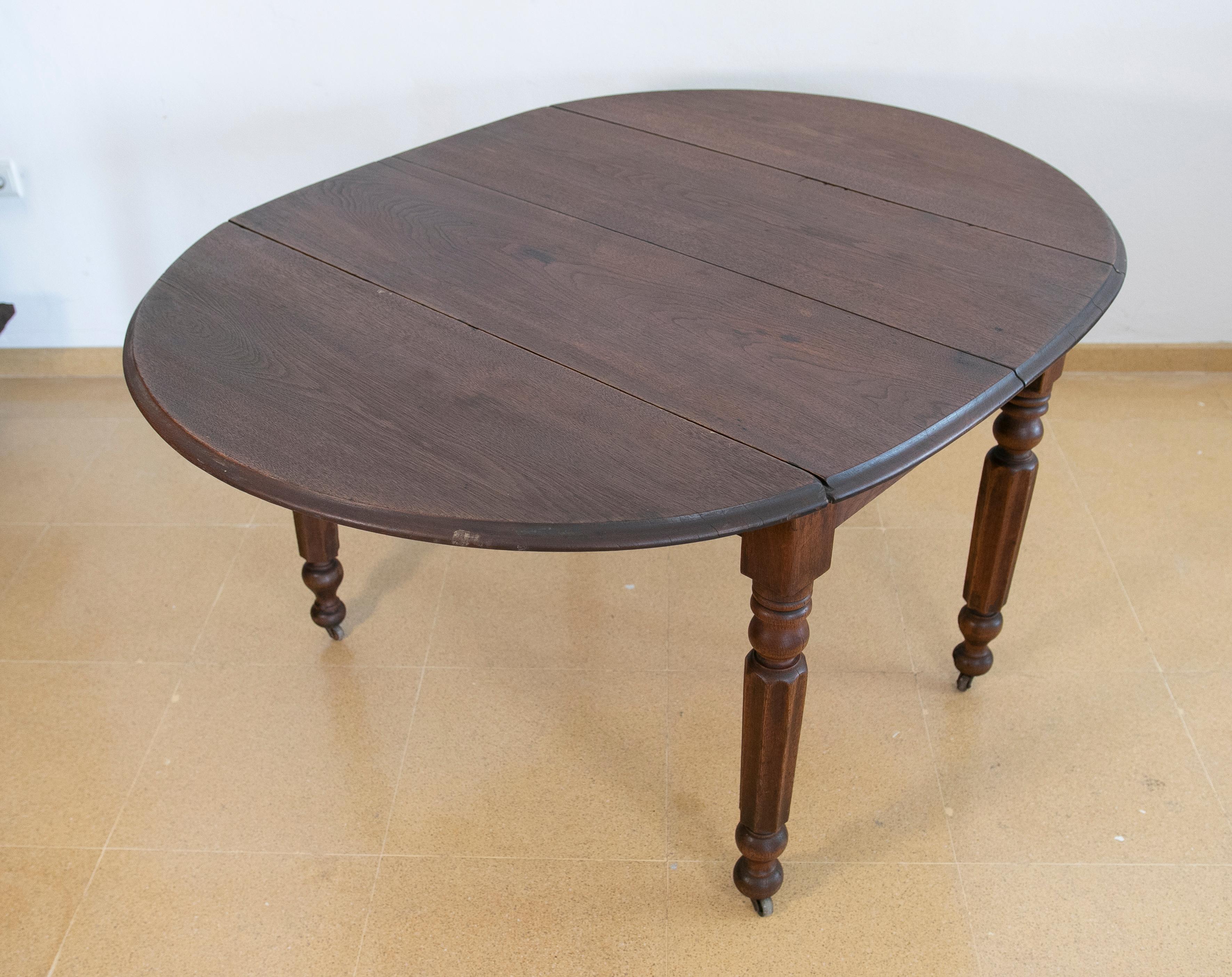 20th Century English Wooden Wing Table with Brass Wheels For Sale