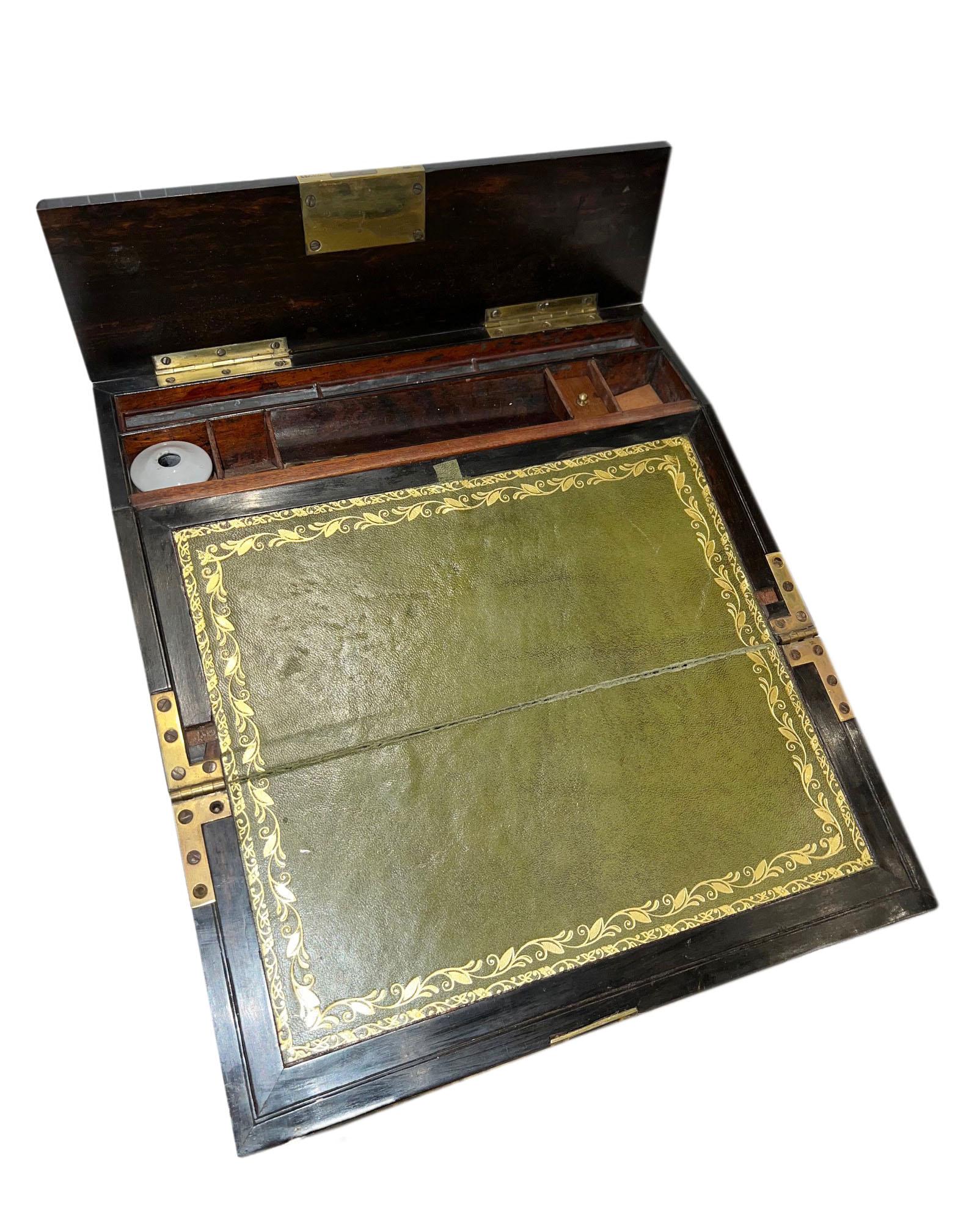 An english wood Writing Desk inlaid with abalone and mother of pearl.  The lock is signed by maker in London, England. Circa 1860.