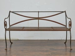 English Wrought Iron Garden Bench with Scroll Arms and X-Back, circa 1920