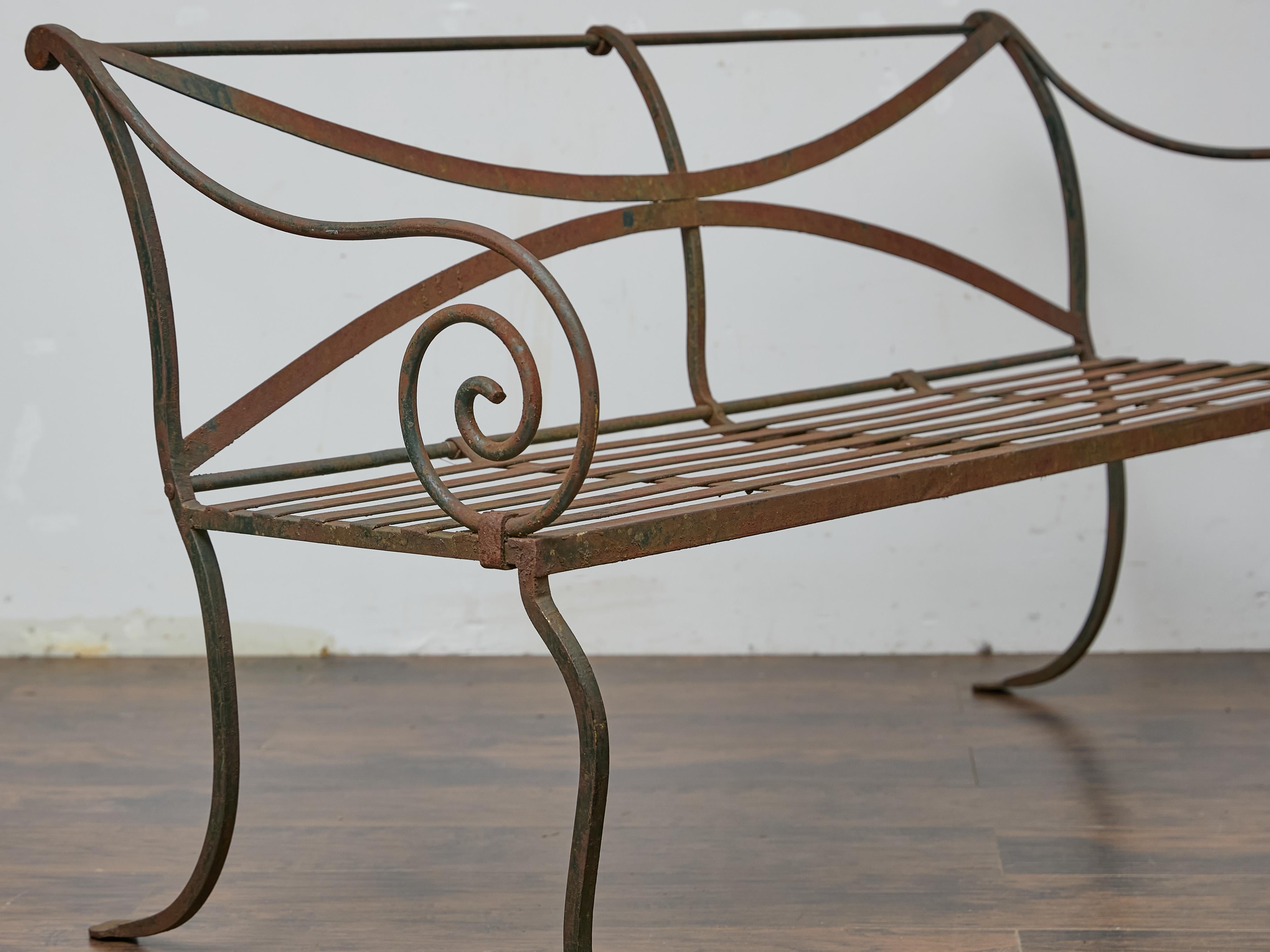 Country English Wrought Iron Garden Bench with Scroll Arms and X-Back, circa 1920 For Sale