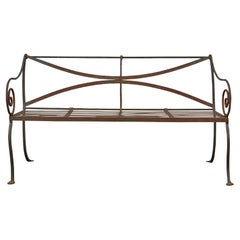 English Wrought Iron Garden Bench with Scroll Arms and X-Back, circa 1920
