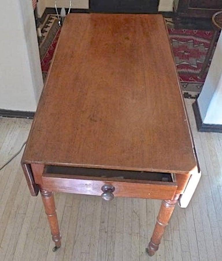 English Georgian 19th century Pembroke drop-leaf writing table or dining table with one deep end drawer.