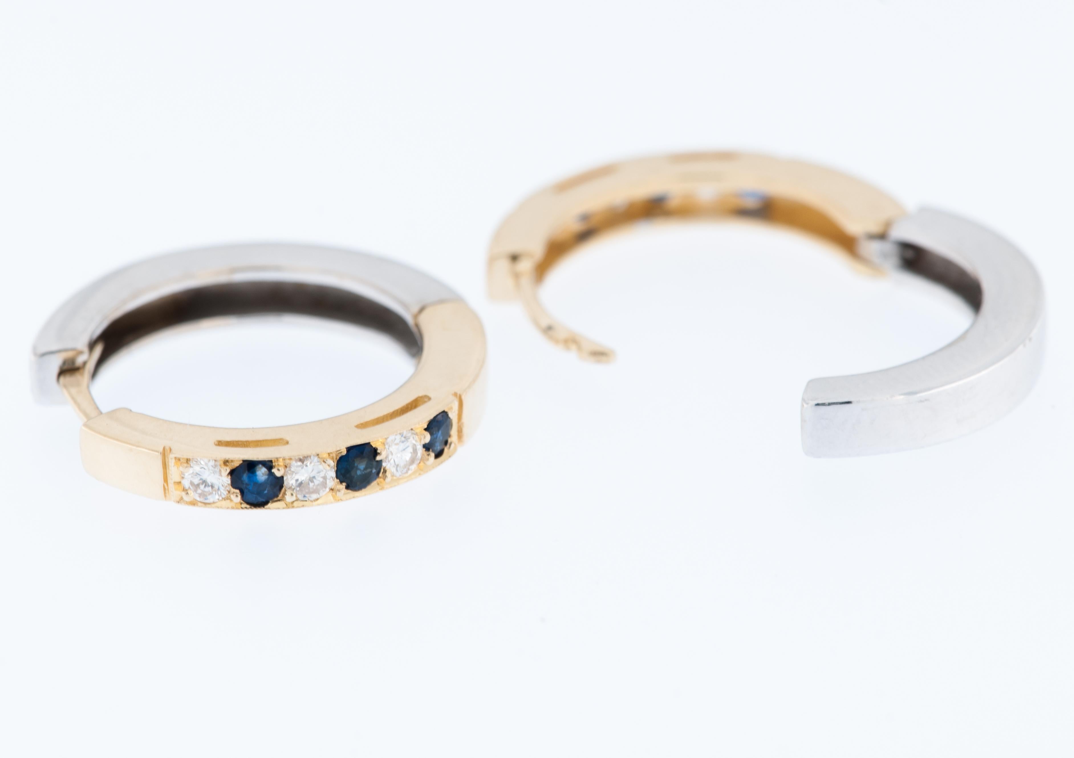 The English Yellow and White Gold Hoop Earrings with Diamonds and Sapphire are a stunning piece of jewelry that combines the elegance of gold with the sparkle of diamonds and the rich hue of sapphires. 

 The earrings are crafted from 18 karat gold,