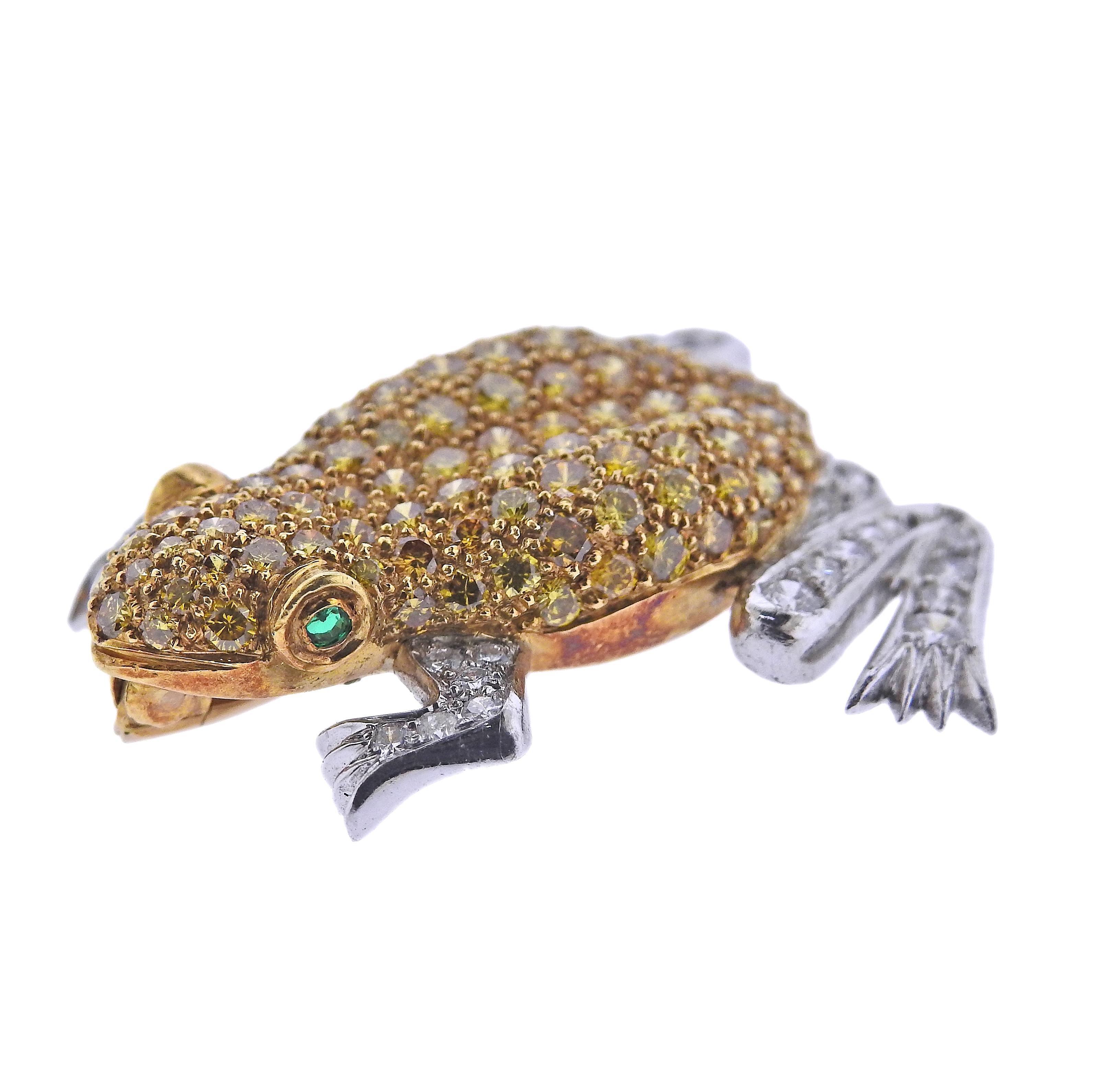 English made 18k yellow and white gold frog brooch, set with yellow sapphires, emerald eyes and approx. 0.64ctw in SI/H diamonds. Brooch is 33mm x 30mm. Marked 750, English marks. Weight - 9.5 grams.
