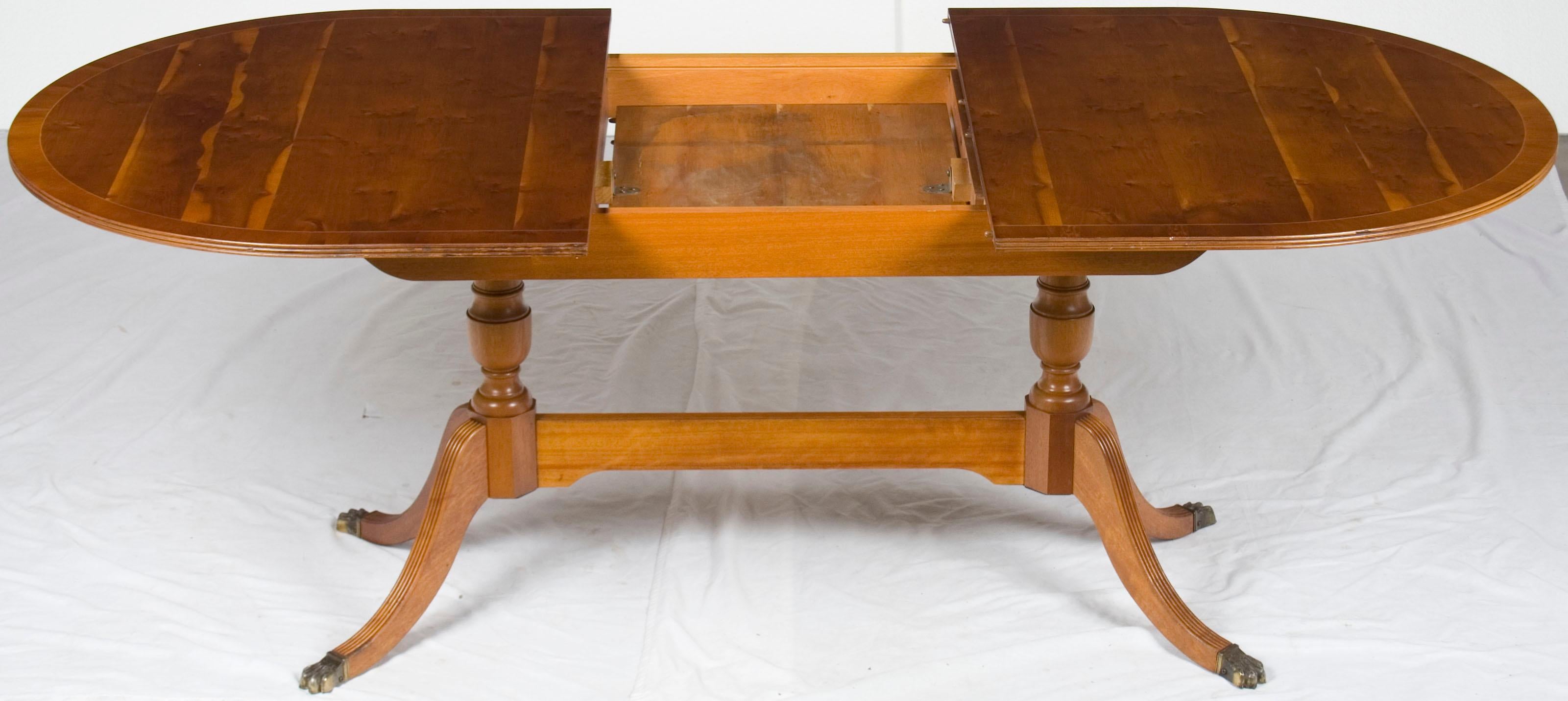 This gorgeous yew dining table with self storing leaf was made in England. It features a single self storing leaf that can bring the length of the table from 1960? to 1978?! This makes the table quite versatile and a great fit for any