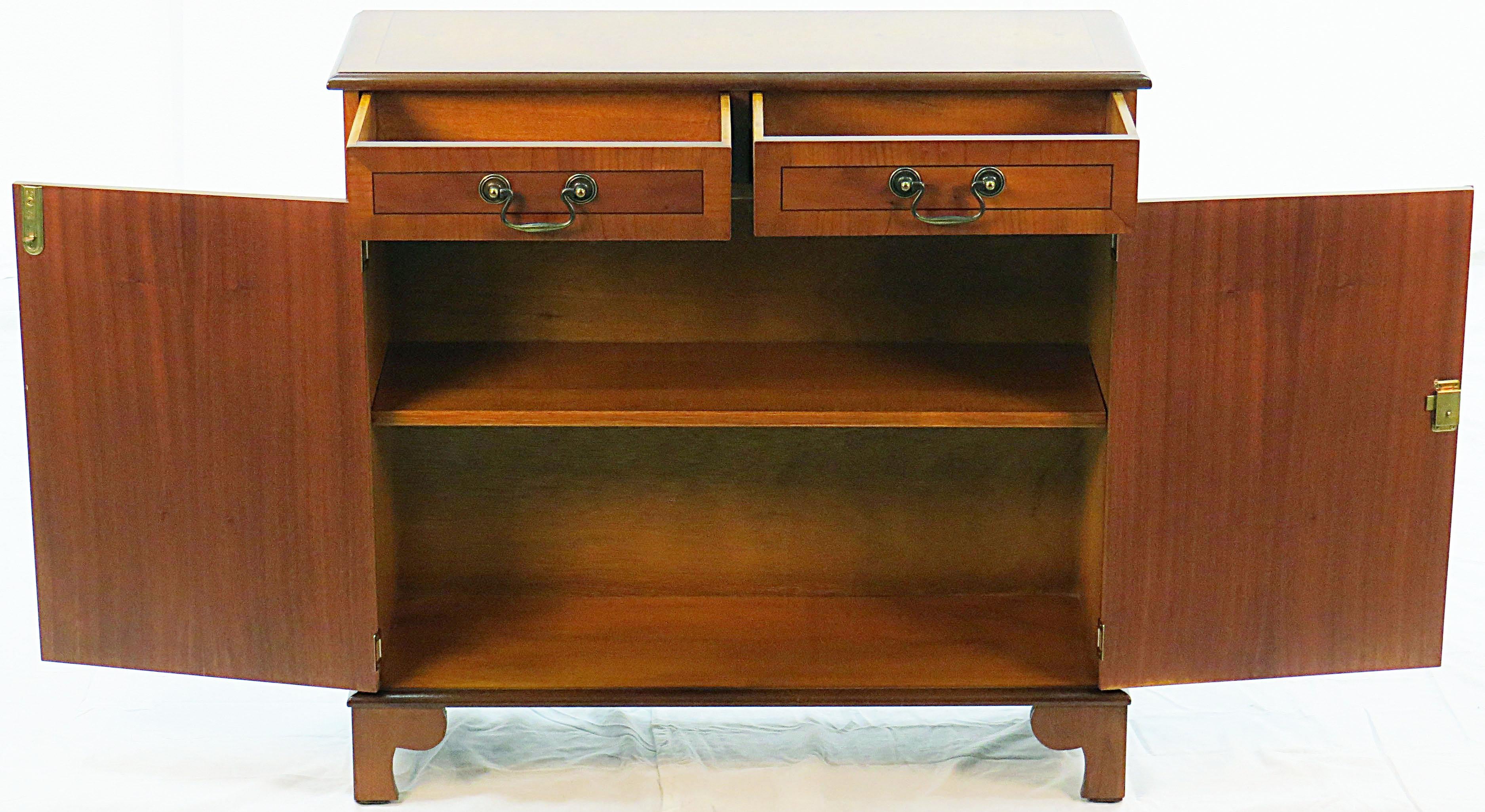 Hailing from England where it was made circa 1960 is this quaint vintage side cabinet. Crafted from the unusual yew wood, it is a beautiful piece of furniture that is just the right size for a plethora of uses.

Yew wood has a lighter color than