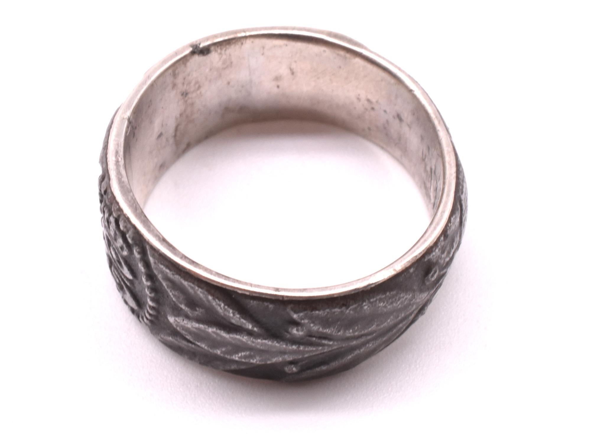  This iron ring is a 20th century version of  the Napoleonic Wars Berlin Iron patriotic Jewelry tradition of giving jewelry made in the Royal Berlin Foundry in exchange for aiding the war effort. 

 In 1916 an attempt was made in Germany to revive