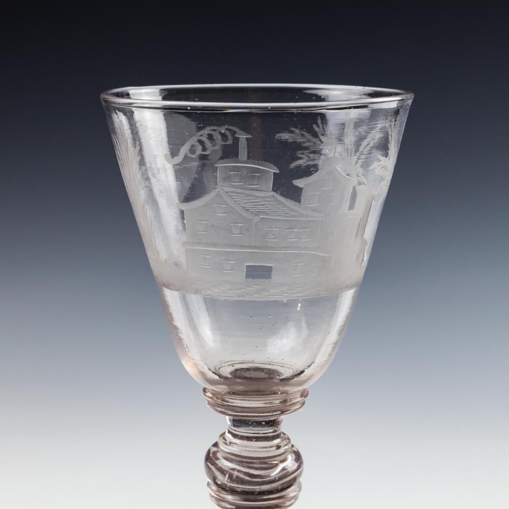 Engraved Bohemian Goblet, c.1710

We have been unable to interpret the engraving. It may simply be decorative. Palm trees are significant within early European Masonry. Huntsman are a frequently used devices within allegory.

Additional