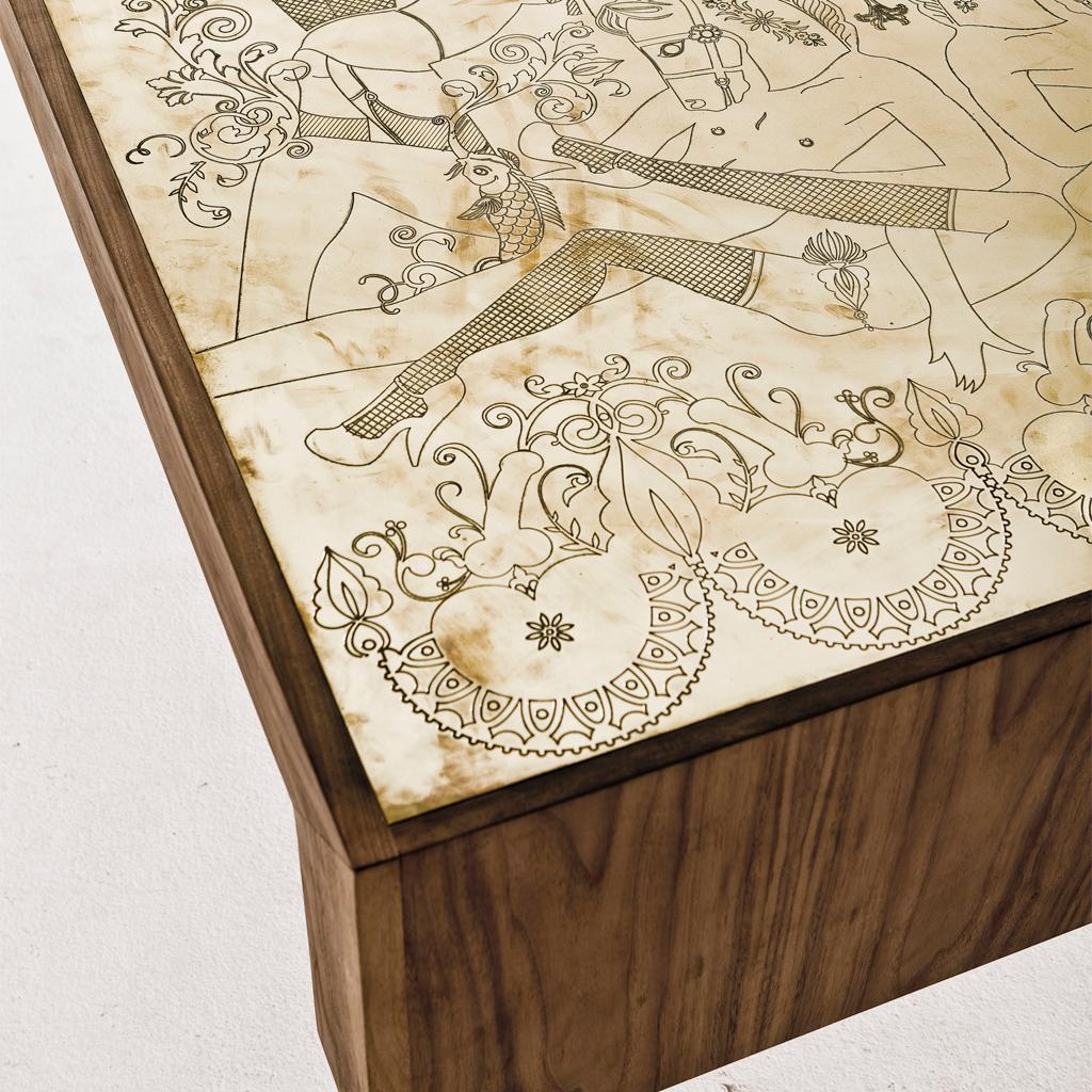The Burlesque table embodies the playful spirit often evident in the works of Egg Designs. 
For this table Egg collaborated with Kim Longhurst a South African illustrator to develop the burlesque design which is engraved into the solid brass top, a