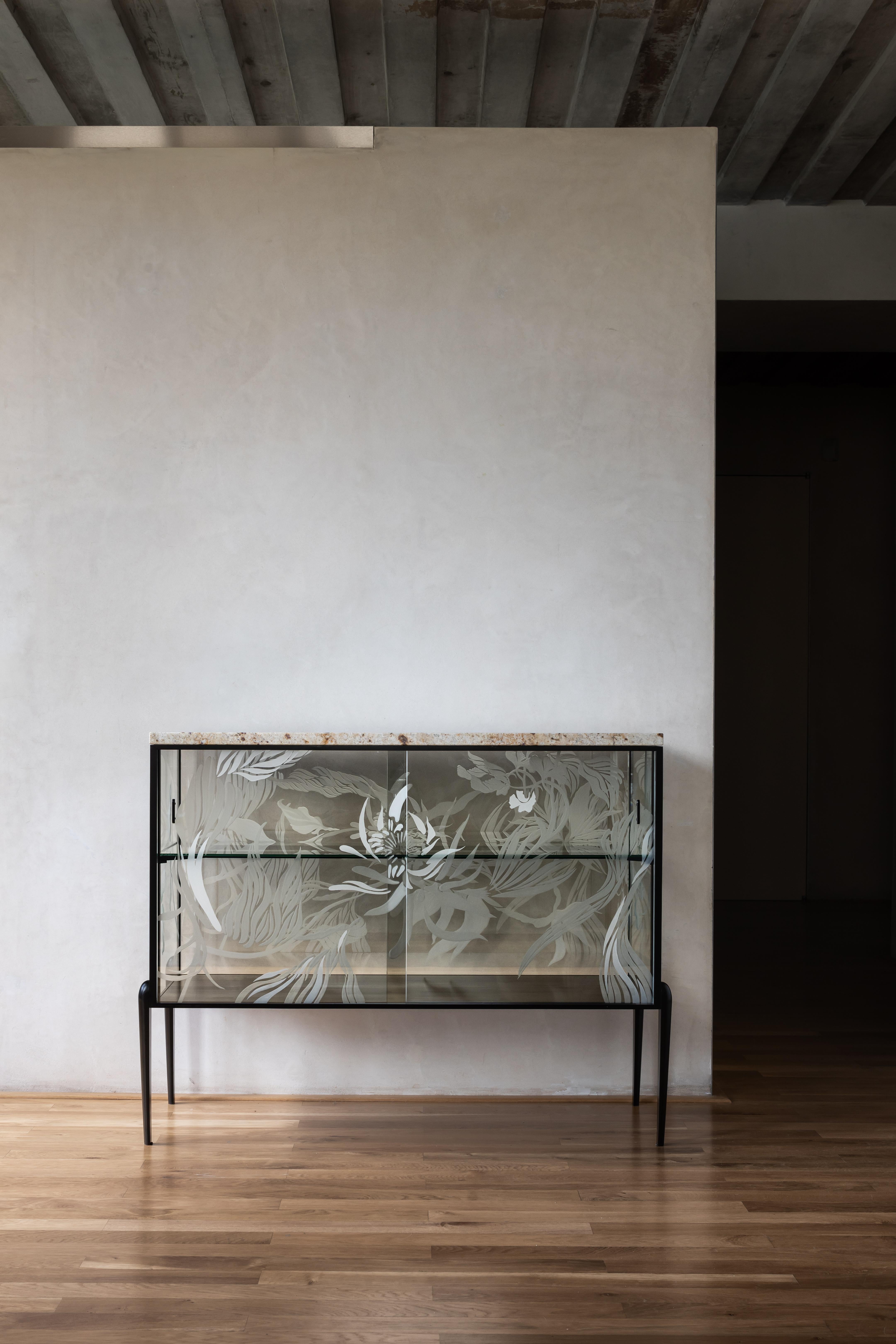 Engraved Cabinet by Elis Monsport
Limited Edition Of 10 Pieces.
Dimensions: D 42 x W 105 x H 85 cm.
Materials: Engraved semi-permeable mirror plate, milled steel, milled marble slab, metal, and powder coating.

Customization is available on request.