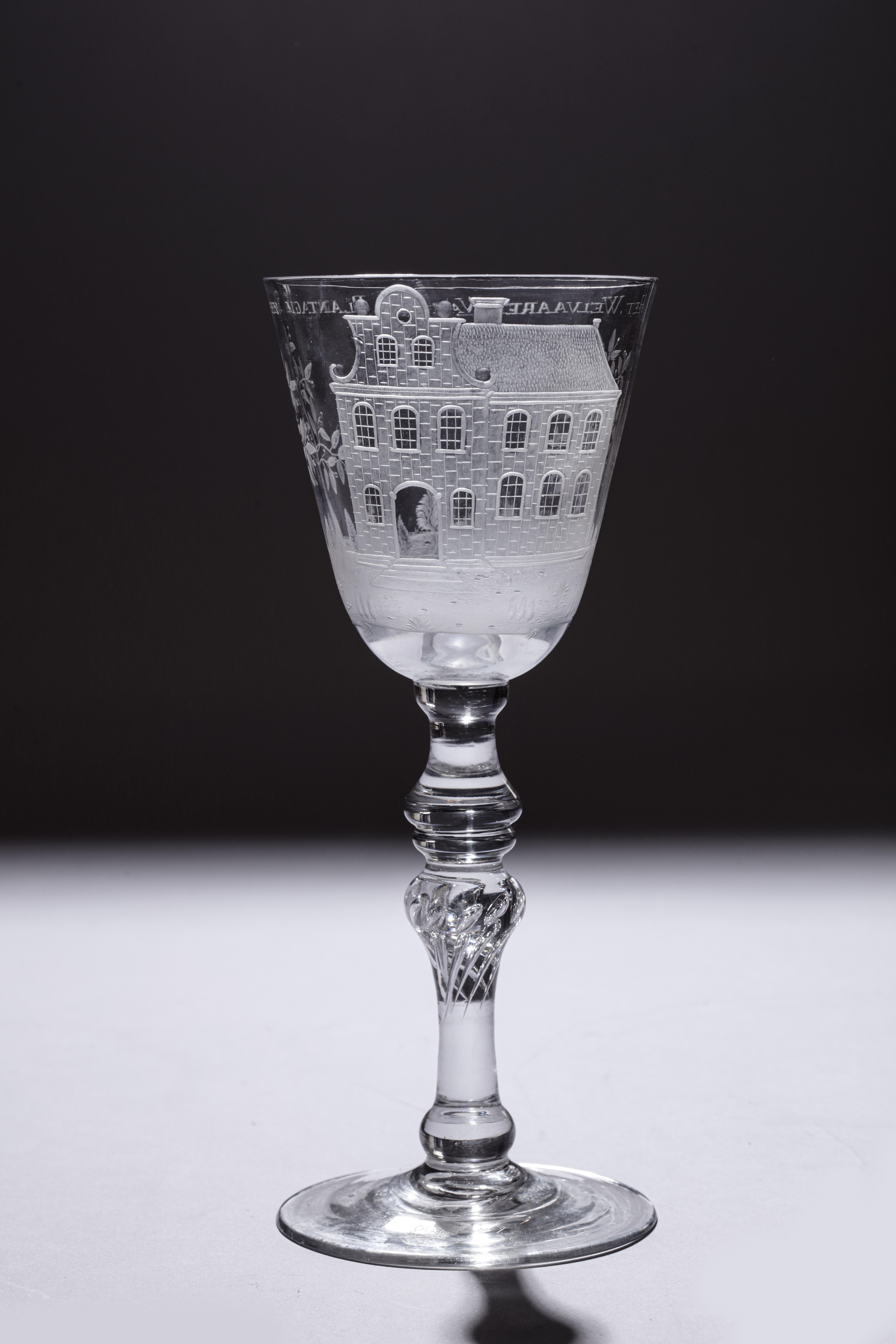 A splendid commemorating glass with a fine engraving of a plantation house and coffee shrubs with a text reading: Het.Welvaaren.Van.De.Plantagie.Saxen (the prosperity of the Plantation Saxen)

English or Dutch lead glass, with Dutch