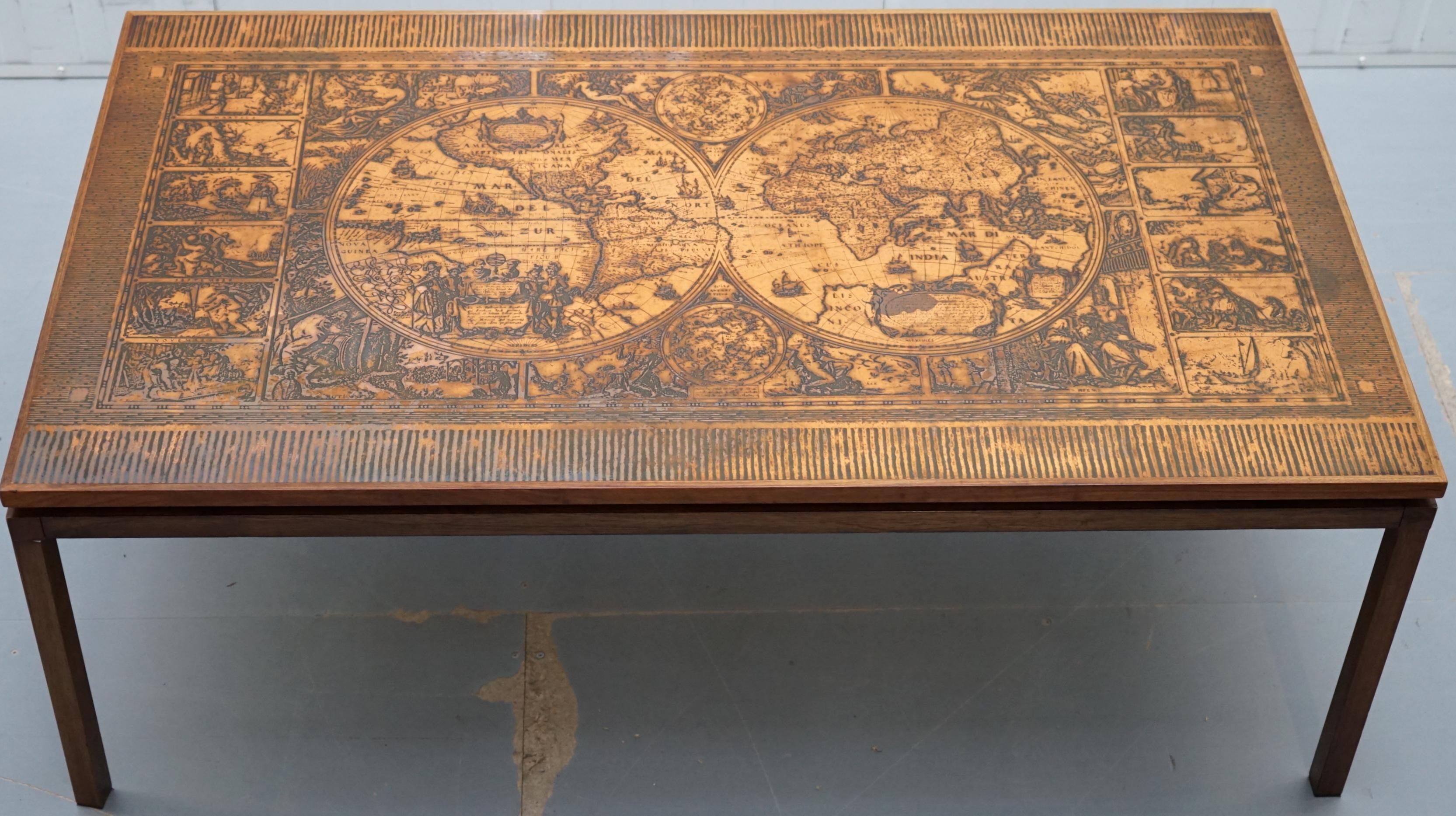We are delighted to offer for sale this highly decorative coffee table with hand engraved copper plate surface depicting the world maps and the Roman calendar 

A very good looking and well-made piece in lightly restored condition throughout. The