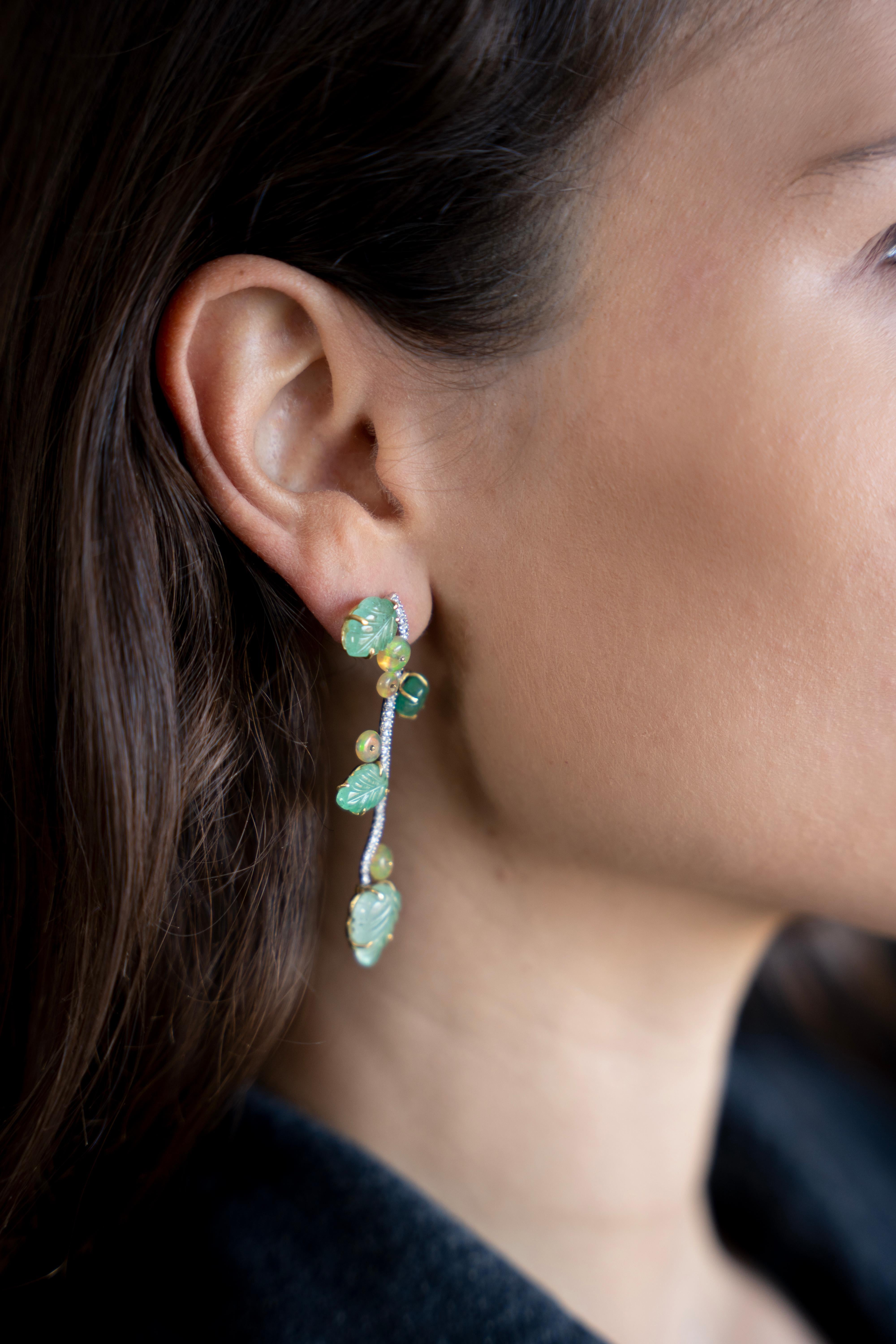 These Unique 18 K earrings have been created from an original vine stalk drawing base design.
This model has eight emerald leaves, weight of 16.06carats, opals bead, weight 3.26carats and
you have 0.61 carat white diamonds on the stalk. Alpas